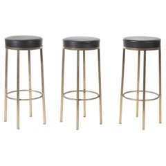 Three Vintage Black Leather Bar Stools with Metal Legs on Circular Support