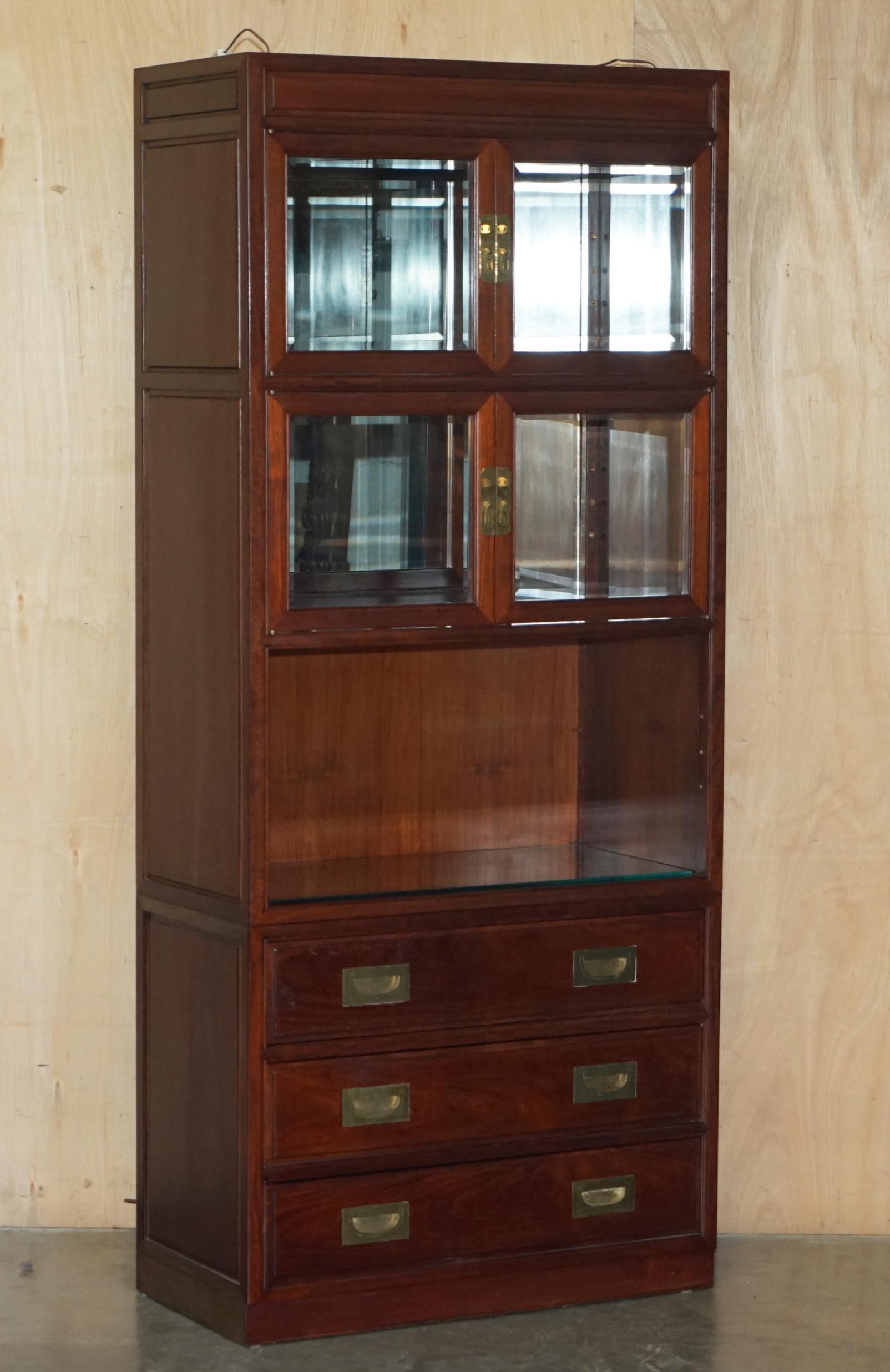 Royal House Antiques

Royal House Antiques is delighted to offer for sale this lovely suite of three, Chinese Rosewood, Military Campaign style bookcases with drawers than can be used as drinks cabinets 

Please note the delivery fee listed is just