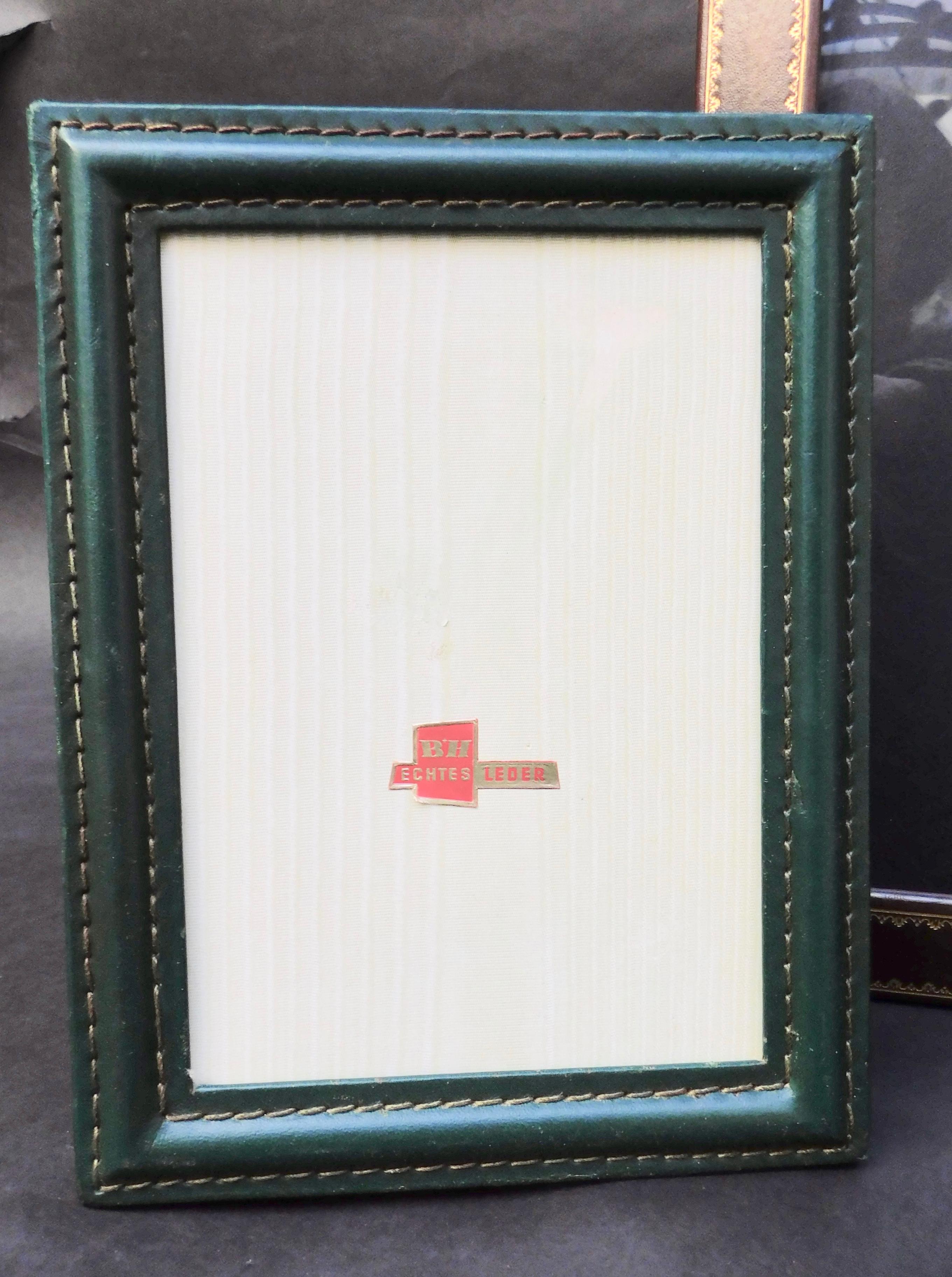 Three leather photo frames from the 1970s. The larger frame is Italian with glass and the other two are Belgian and have no glass. The measurement shown is for the largest frame, the other two Measures:
Small 16.50 x 12.50 cm (6-1/2