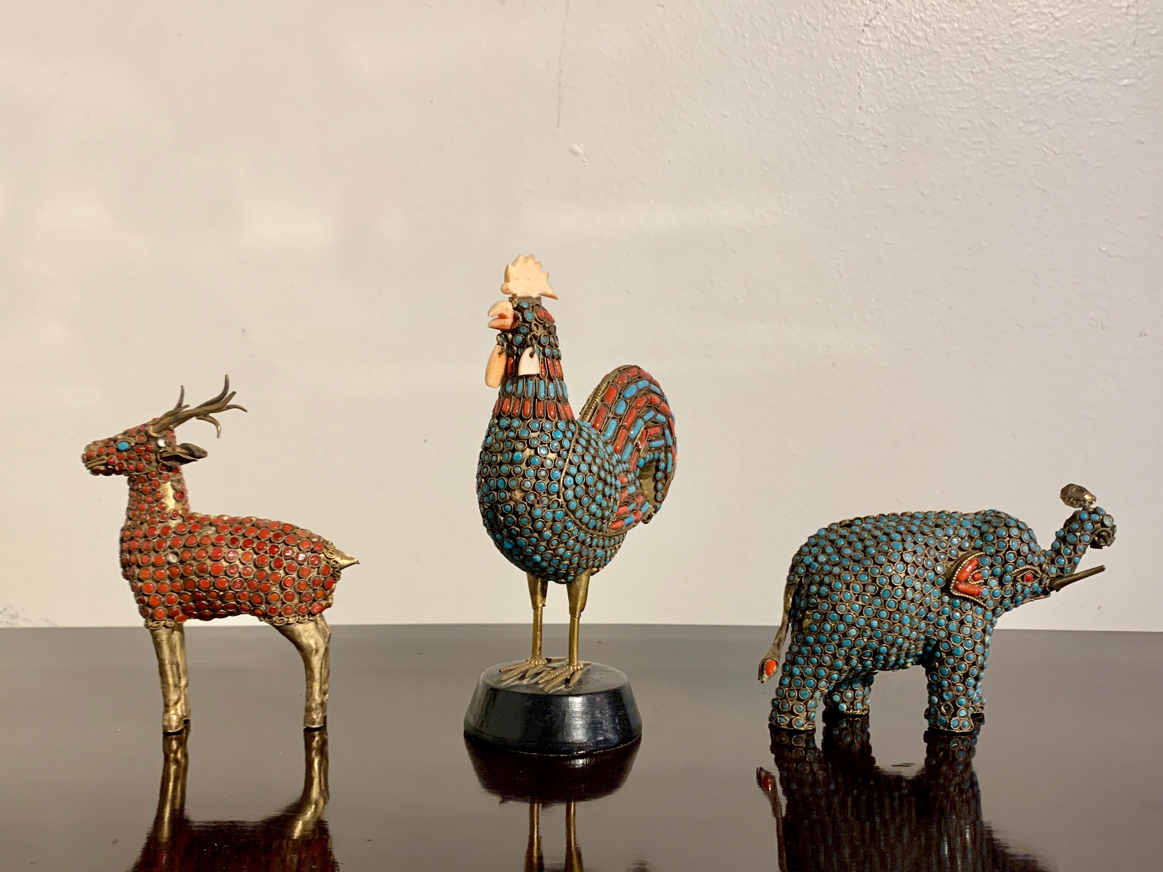 A charming group of three vintage Nepalese brass and inlaid glass bead animals, consisting of a rooster, a deer, and an elephant, 1970's, Nepal.

All three animals crafted in the traditional manner, made out of brass sheet and wire, and inlaid