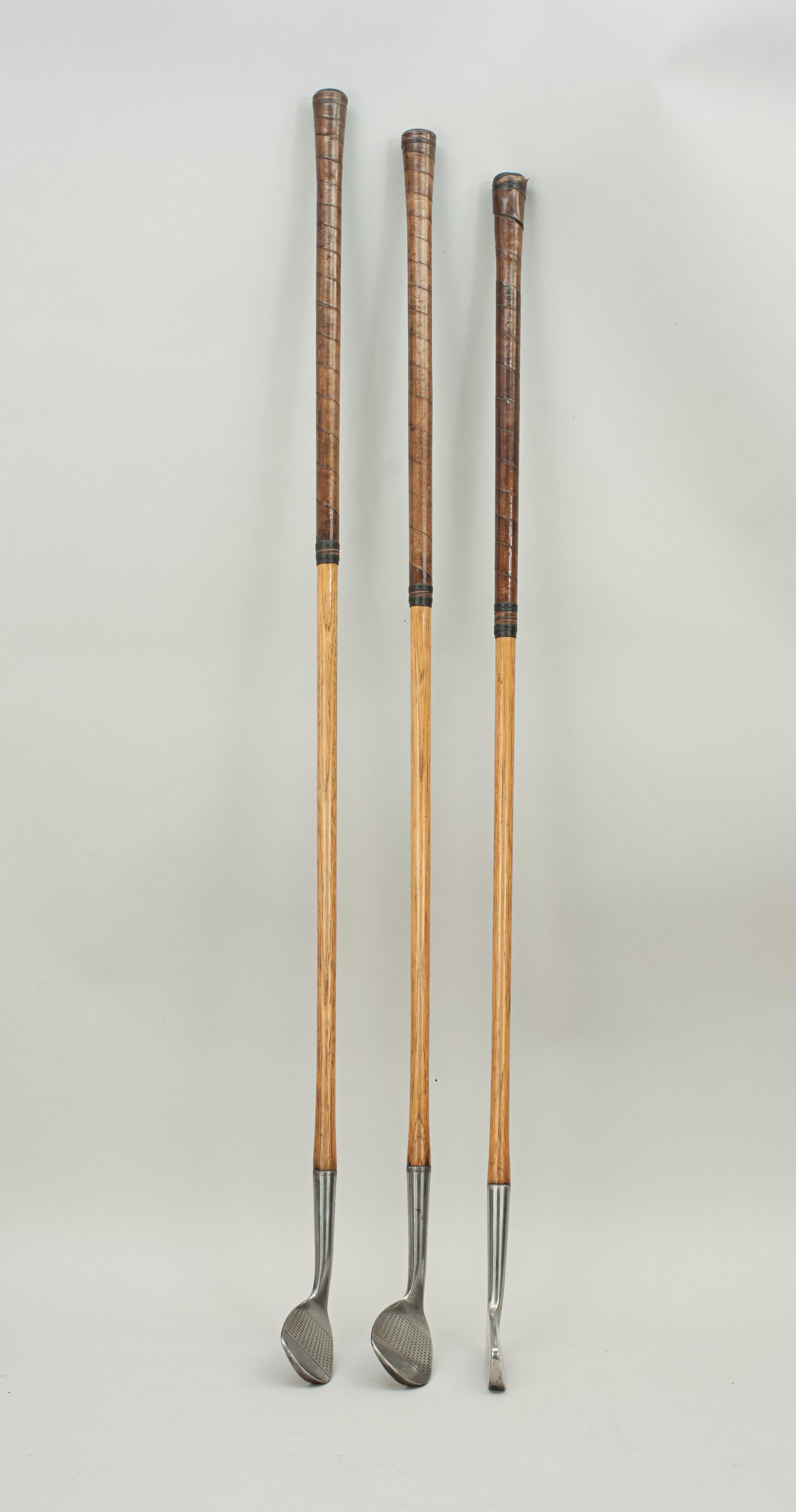 Set Of Three Gibson Hickory Golf Clubs, The Civic Model.
Three playable hickory shafted golf clubs by Gibson of Kinghorn, Fife, 'The Civic Model'. The Mashie, Mashie-Niblick and Putter are all marked 