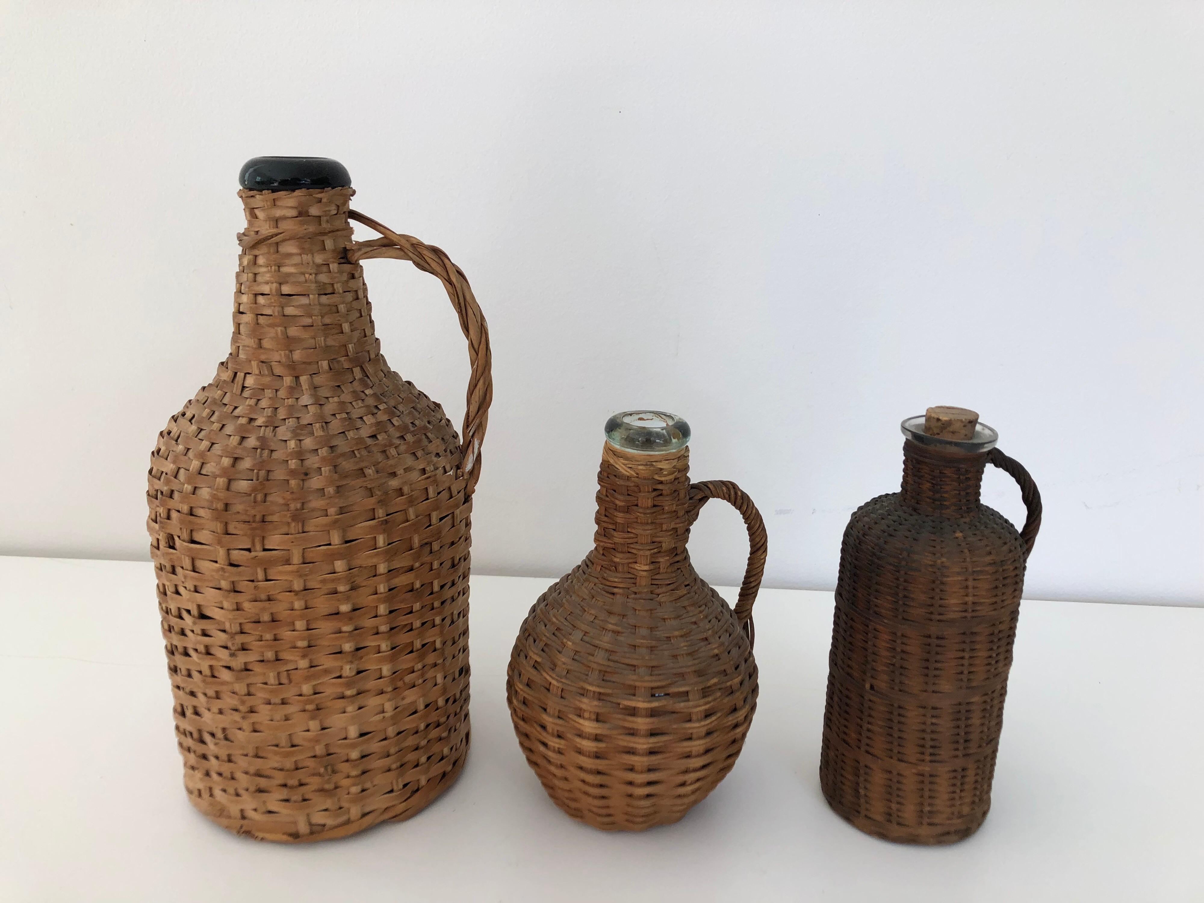 Unknown Three Vintage Wicker Wrapped Jugs
