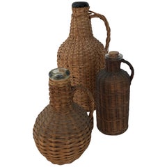 Three Antique Wicker Wrapped Jugs