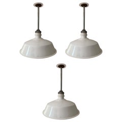 Three White Enamel Industrial Pendant Lights