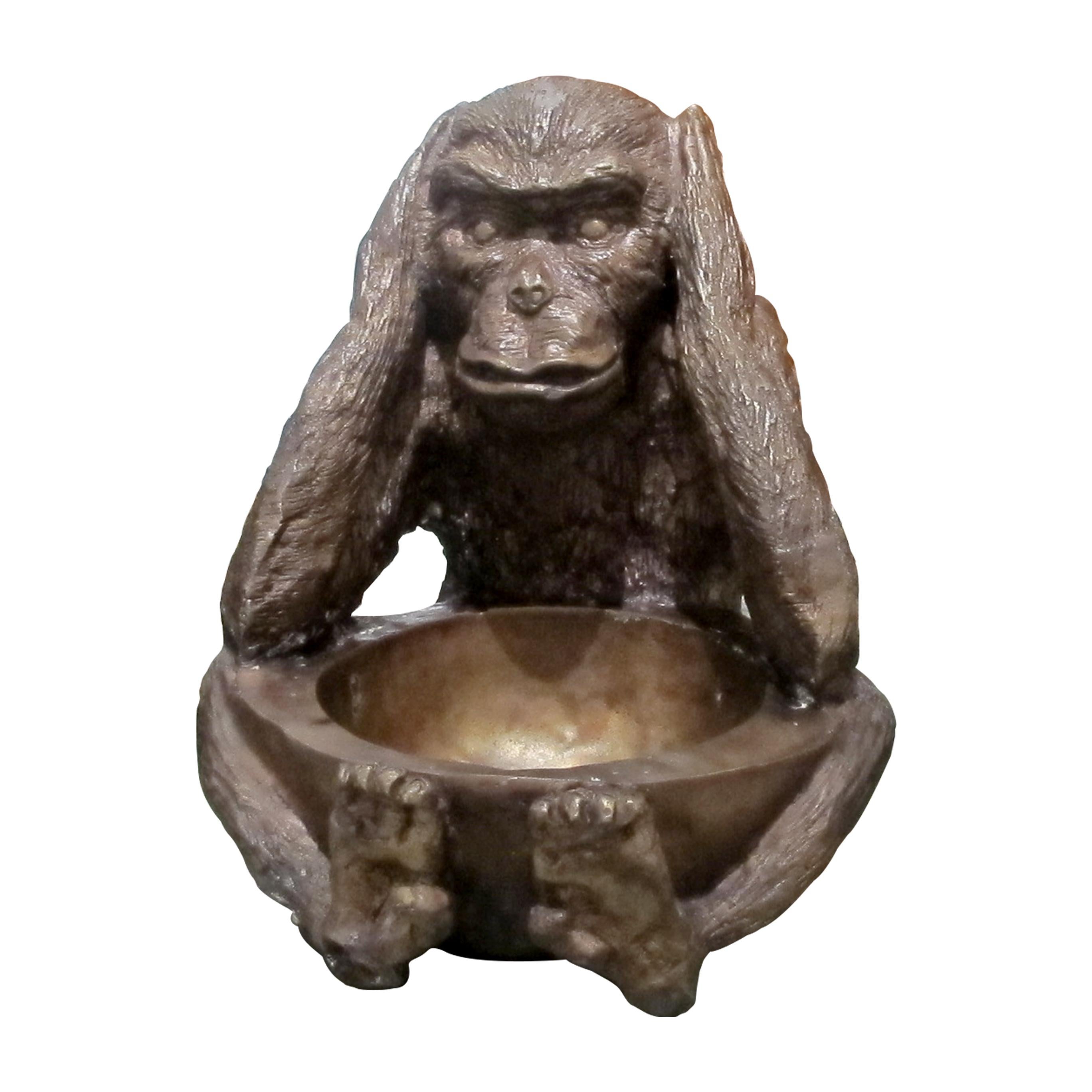 This set of bronze monkey sculptures depicts the classic motif of the 