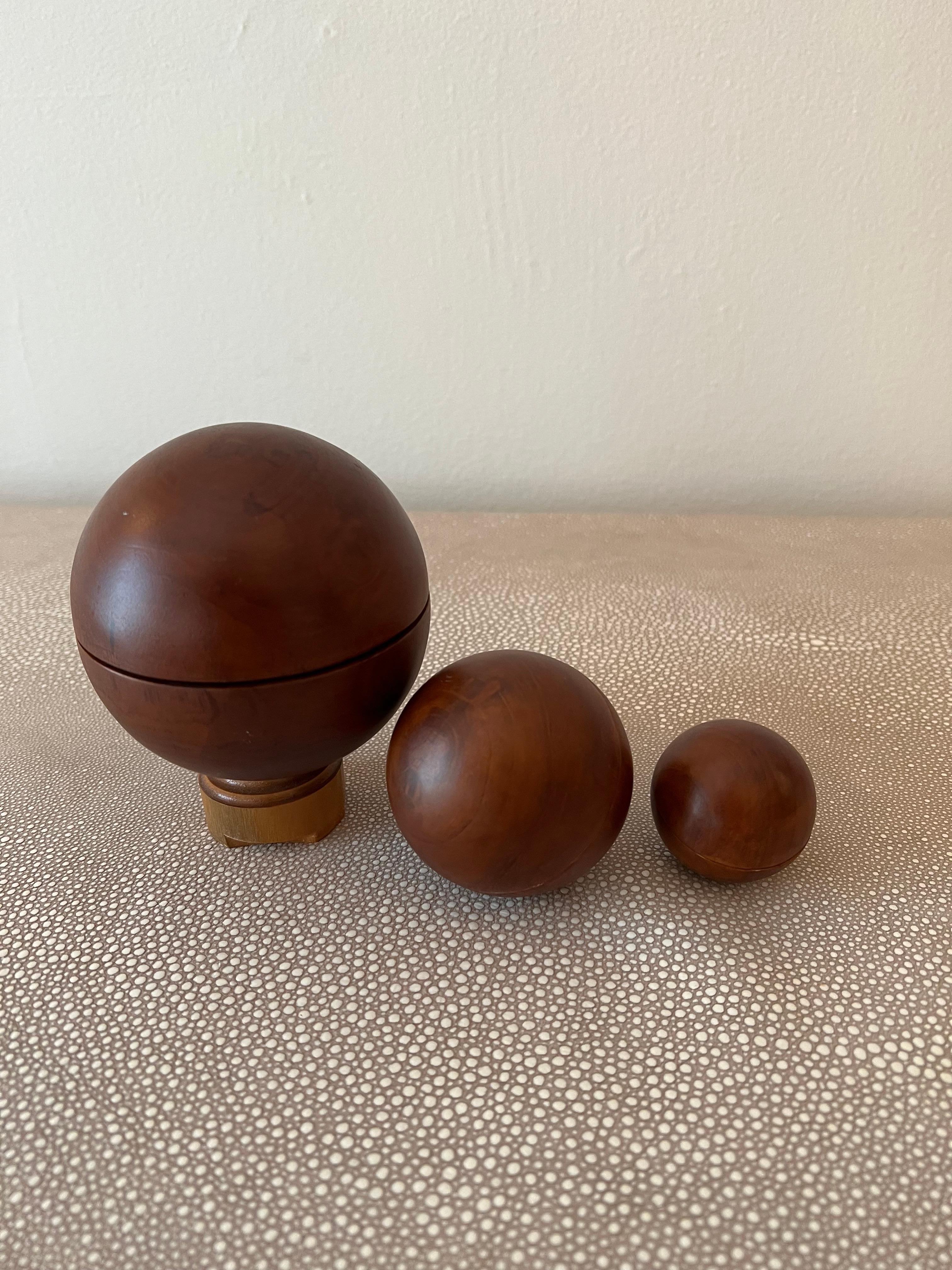 a spherical wooden ball 15 cm in diameter