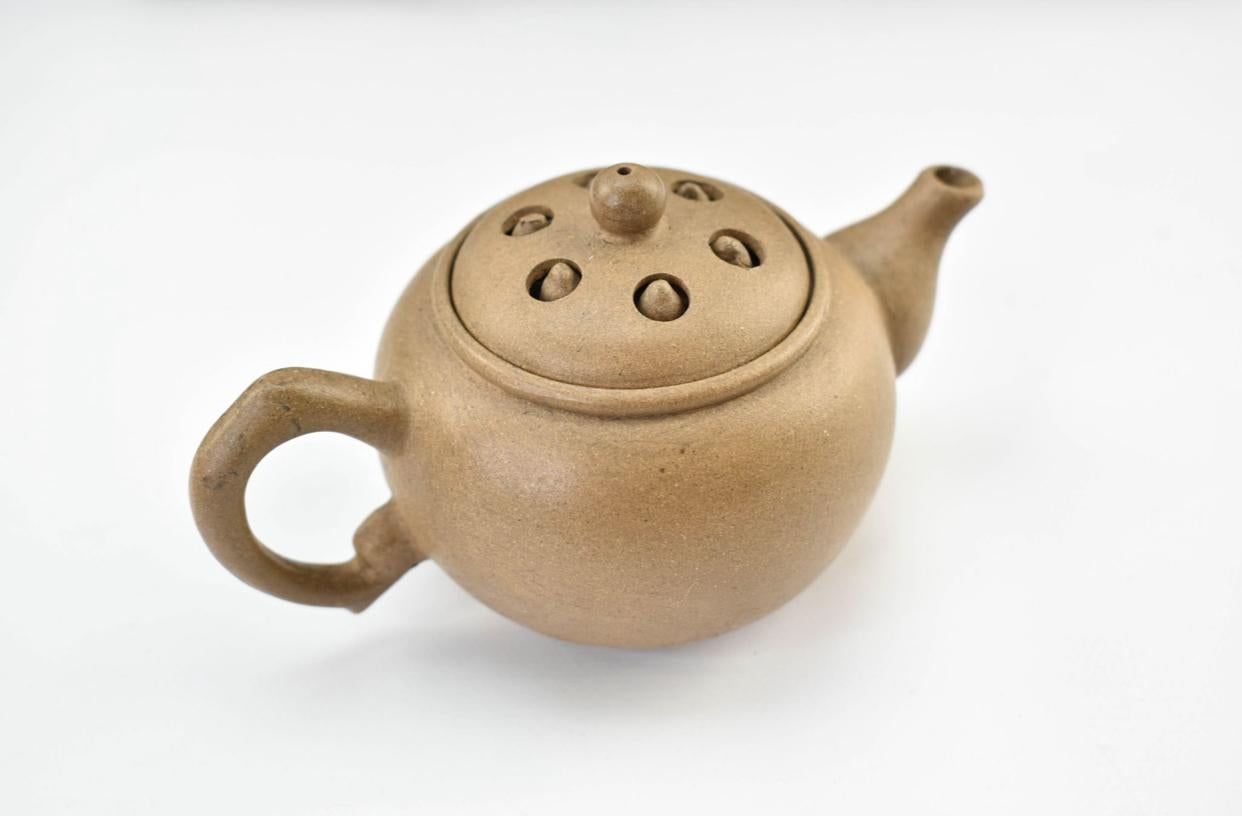 Clay Three yixing teapots in a velvet lined box. Each teapot is a different color. For Sale