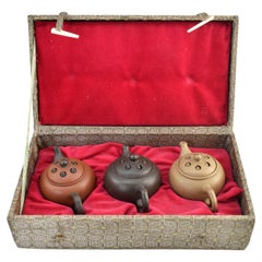 Vintage Three yixing teapots in a velvet lined box. Each teapot is a different color.