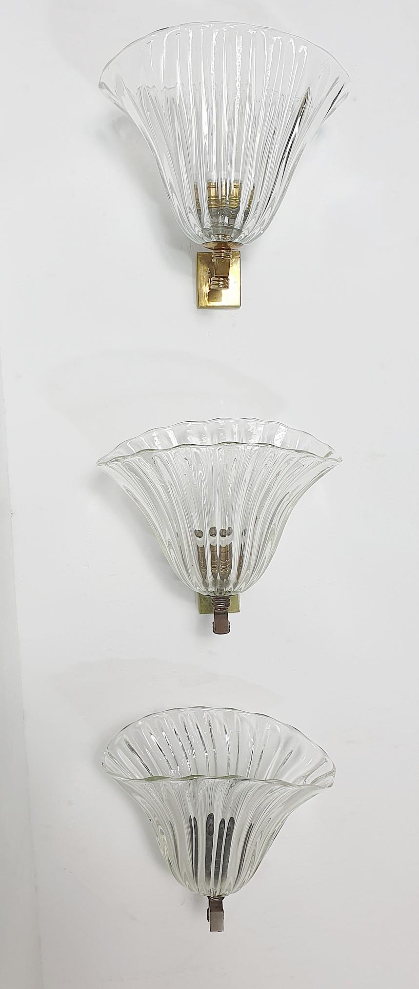 An original 1950's wall sconce produced by Seguso in Murano, Italy in perfect condition and have the original bracket designed for this glass specifically. There is only one of these.