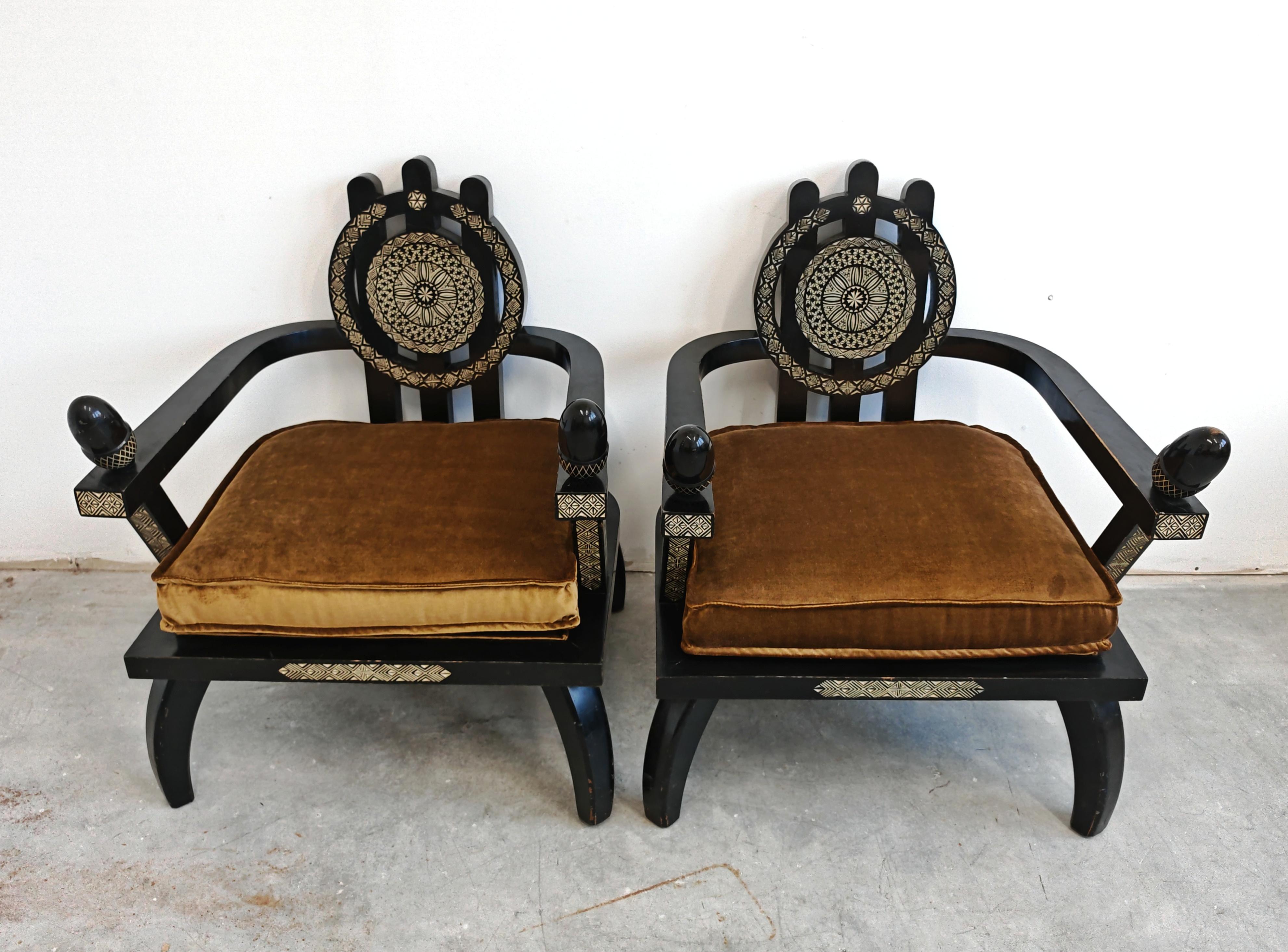 In this listing you will find exceptionally rare antique armchairs designer by Ettore Zaccari. They feature throne-like form with acorns at the end of their armrests. The armchairs are done in ebonized solid oak. Originally designed in Italy in the