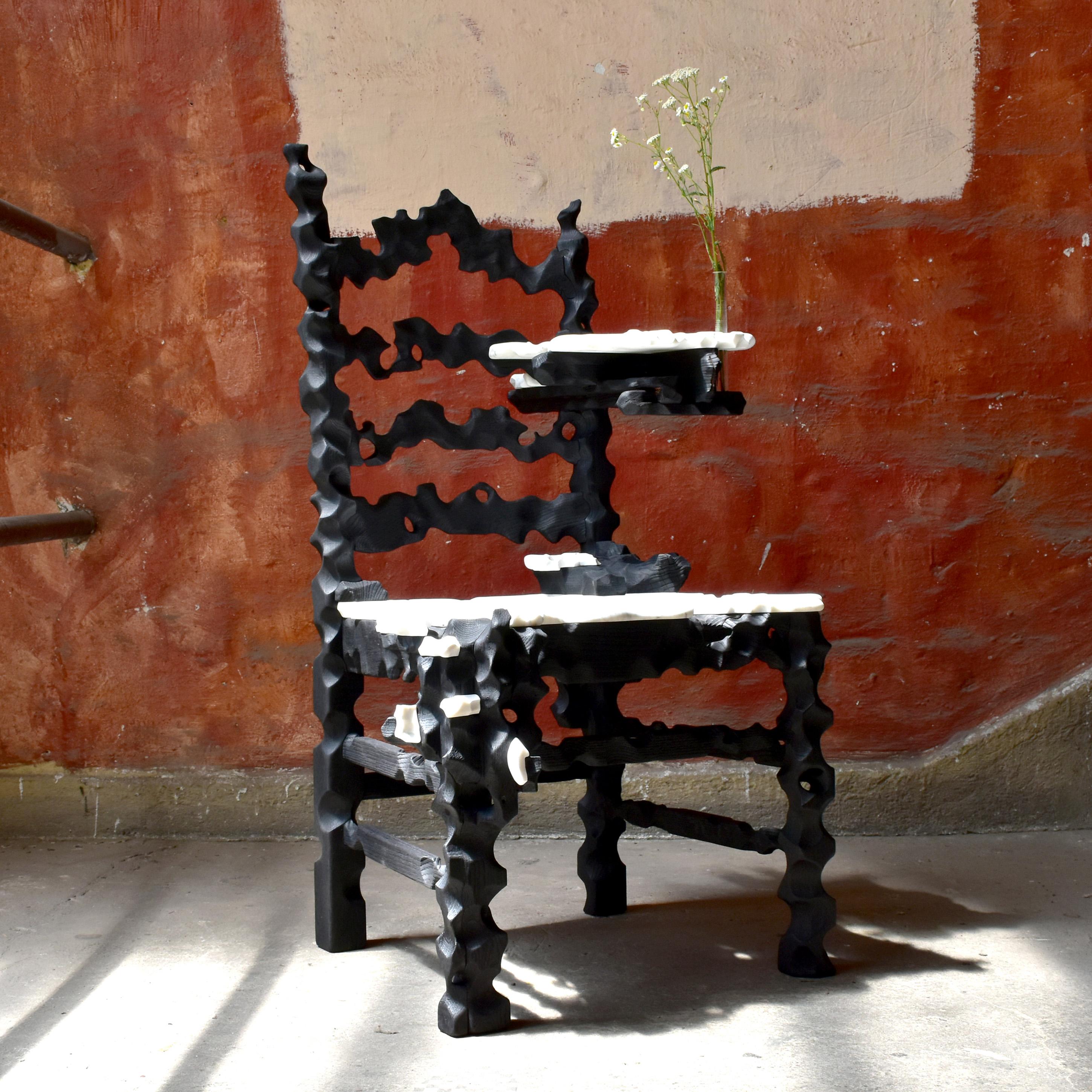 Throne Side Table by Gabor Gobi
Unique Piece.
Dimensions: D 75 x W 65 x H 104 cm.
Materials: Oak wood and white marble.

This hand carved art object is crafted from a repurposed dining chair and remnants of white marble. This sculptural piece has