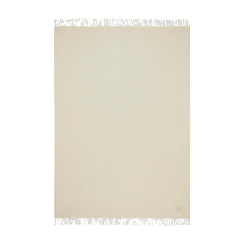 The KOKO collection is composed of yarn-dyed jacquard throws with tone-on-tone
 fringes and a K三 monogram pattern. This throw is a natural cream colour with a dreamy and sophisticated feel.