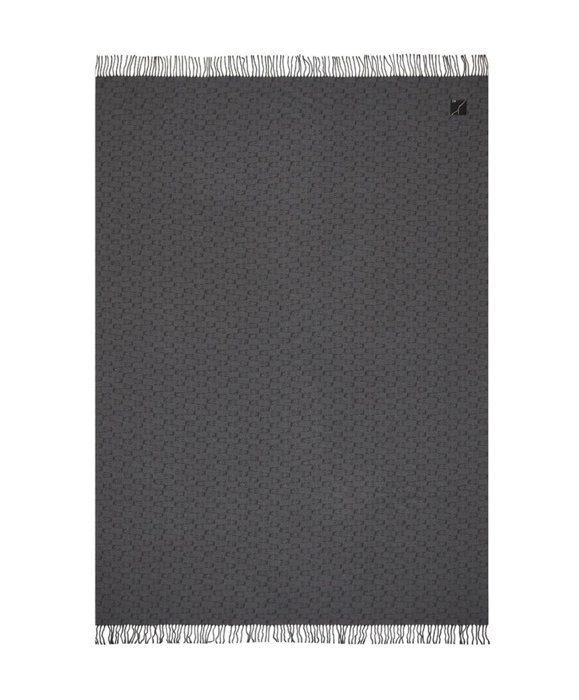 The KOKO collection is composed of yarn-dyed jacquard throws with tone-on-tone
 fringes and a K三 monogram pattern. This throw is an elegant gray colour with a bold and modern feel.