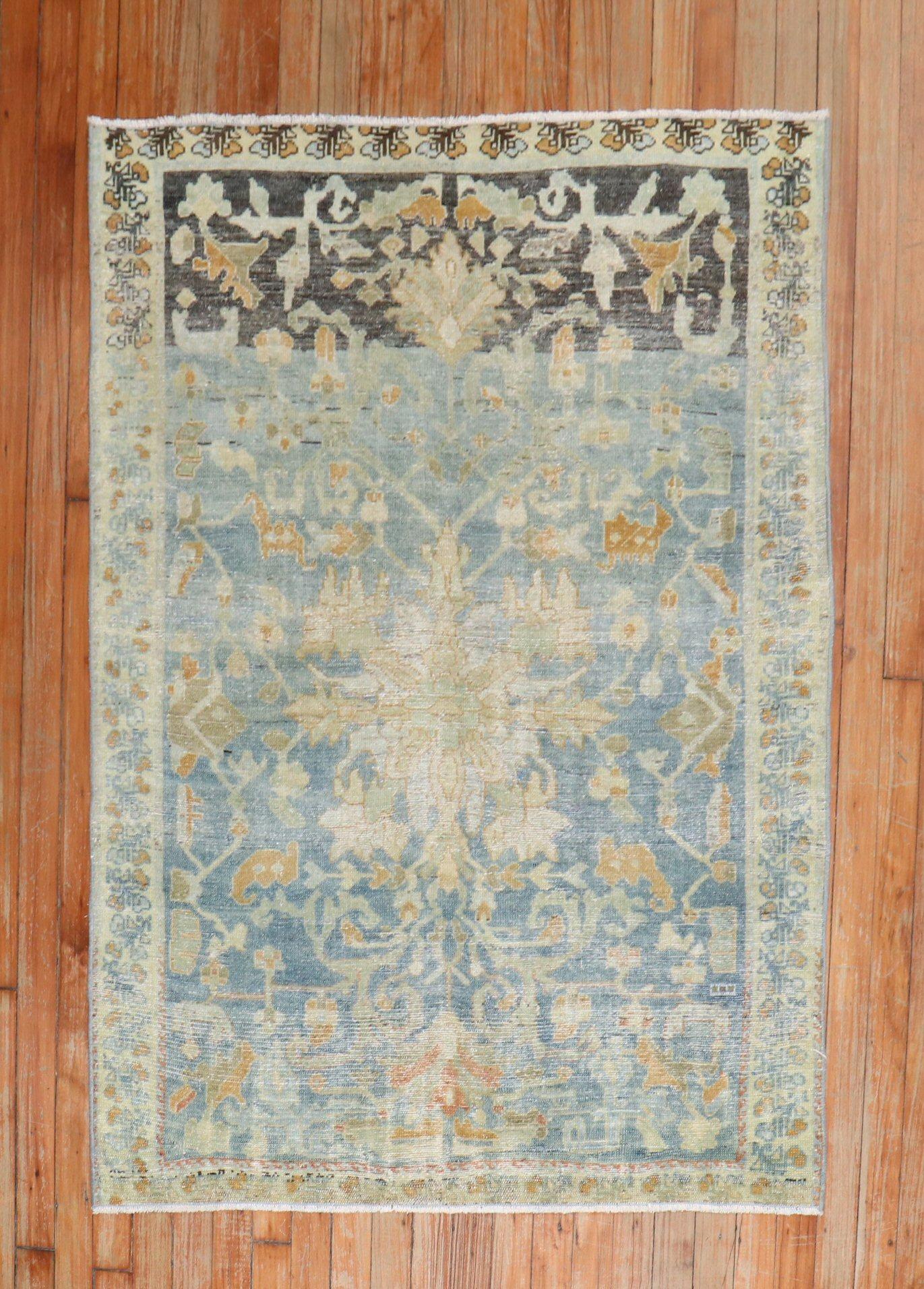 A throw size early 20th century Persian Malayer rug in blue, charcoal, and apricot

Measures: 3'5