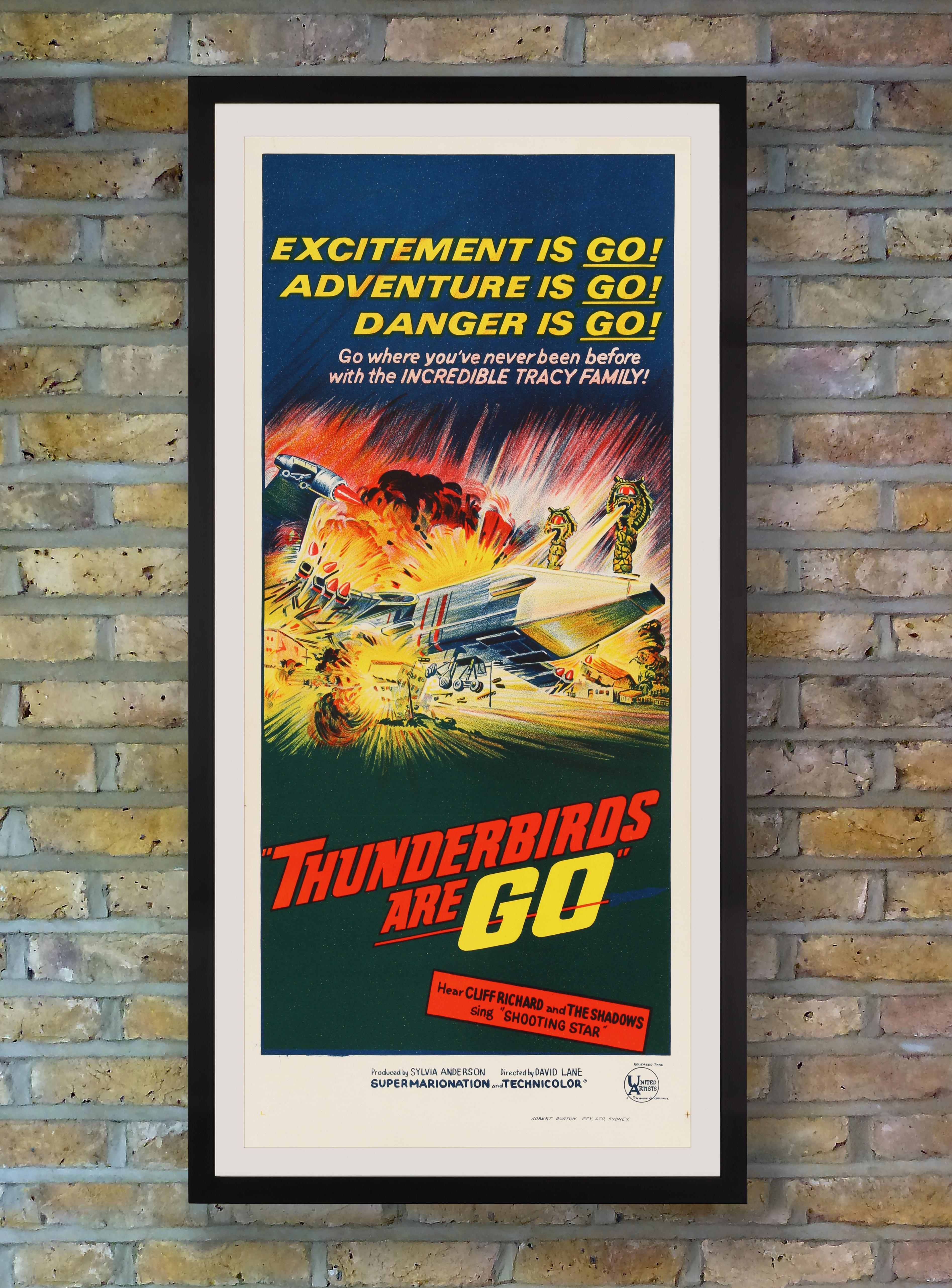 Printed in stunning stone lithography, this explosive Australian Daybill poster advertised the first full length feature film based on the British sci-fi Supermarionation television series 'Thunderbirds.' Created by Gerry and Sylvia Anderson,