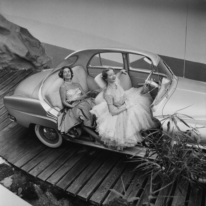 "Simca Aronde" by  Thurston Hopkins

1st October 1956: Two models posing in a cutaway Simca Aronde at the Paris Motor Show. Original Publication: Picture Post - 8714 - Cars For 1957 - pub.

Unframed
Paper Size: 30" x 30'' (inches)
Printed 2022