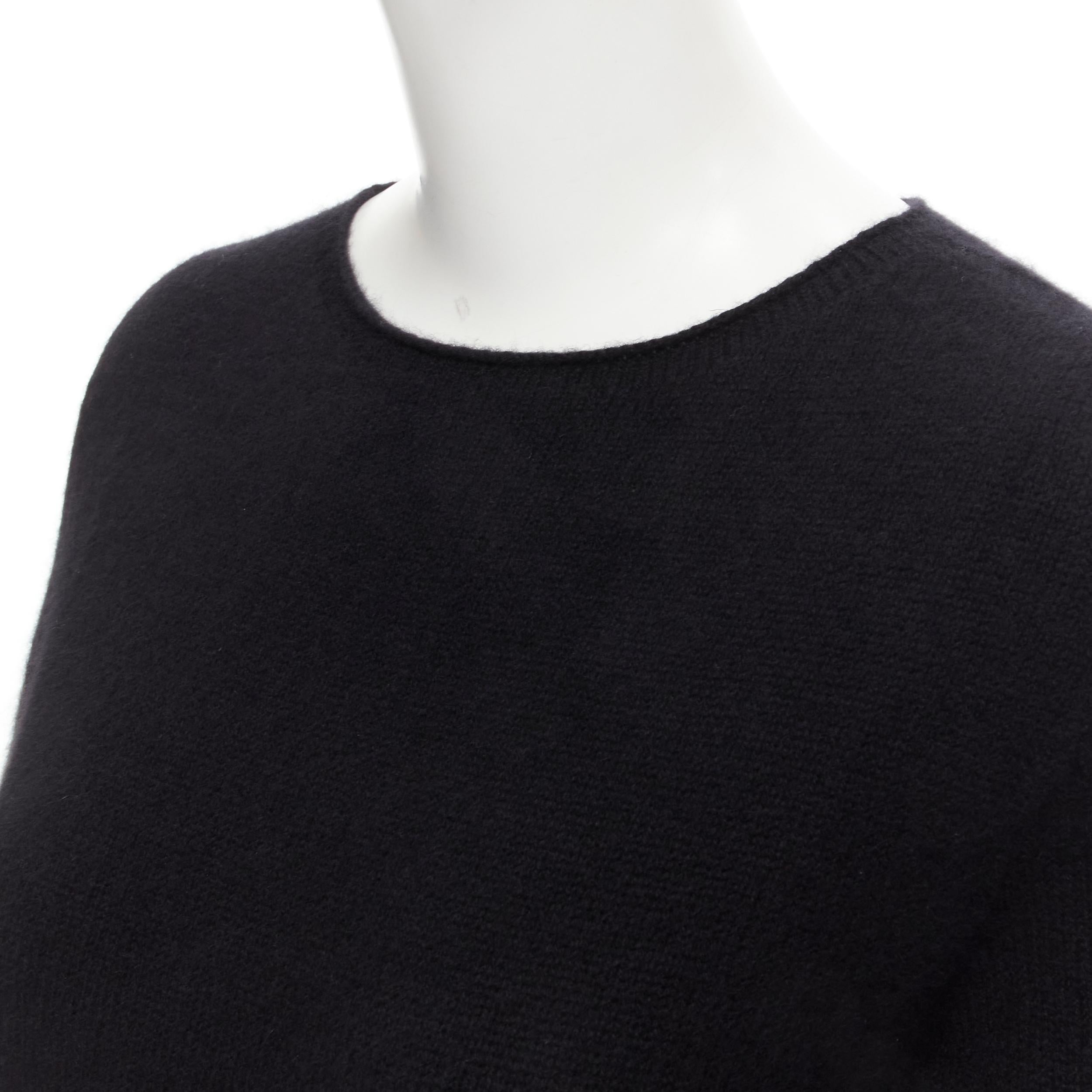THW ROW black round neck short sleeve flared tunic sweater top XS 
Reference: MELK/A00032 
Brand: The Row 
Material: Wool 
Color: Black 
Pattern: Solid 
Extra Detail: Flared hem. 
Made in: USA 

CONDITION: 
Condition: Excellent, this item was