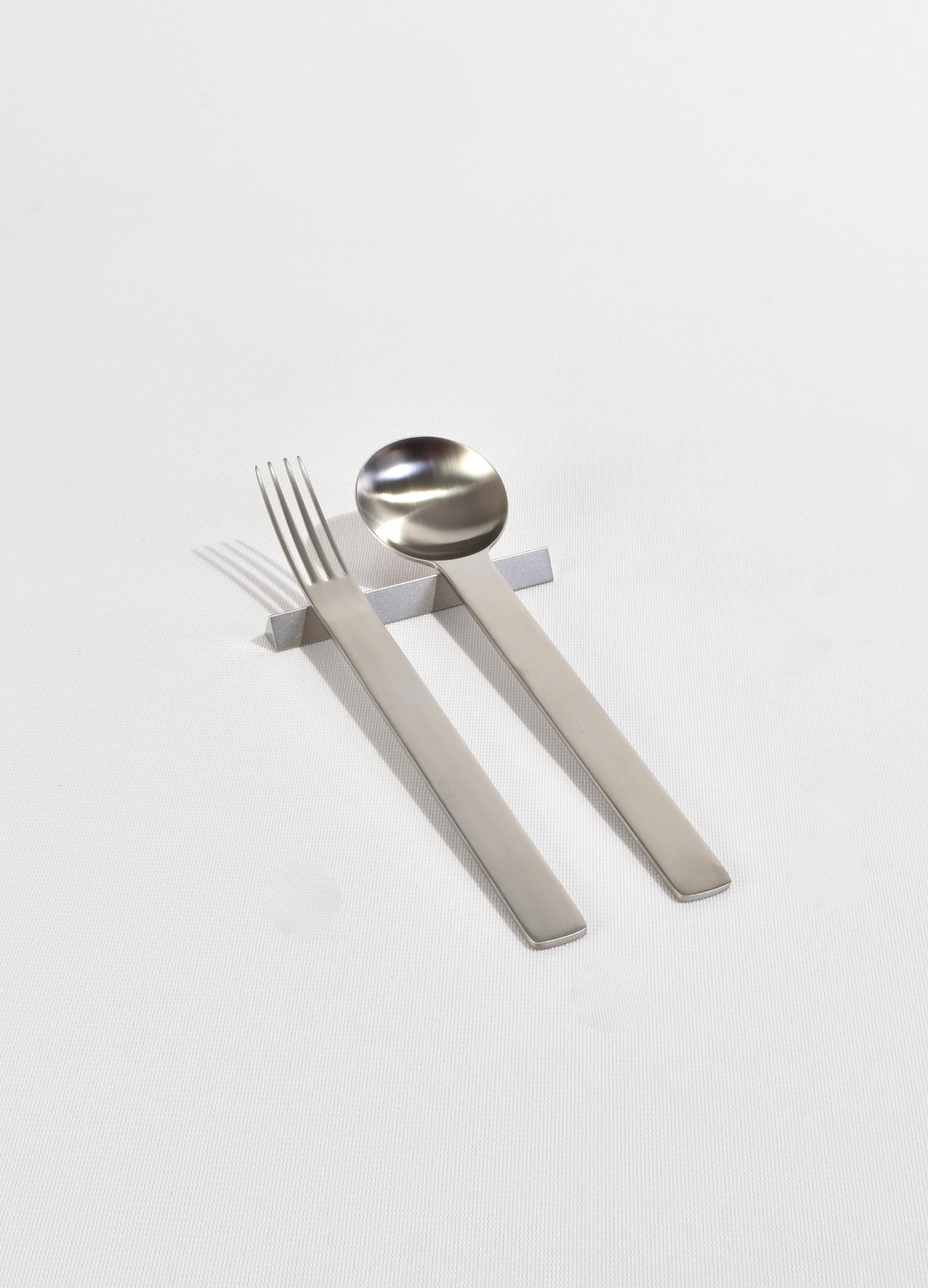 5-piece boxed cutlery set 'TI-1' by Japense designer Takenobu Igarashi, ca. 1990. Made from lightweight 18/10 stainless steel in a matte finish, the series is finished by 40-50 production processes combining human hand and machinery. Each piece is
