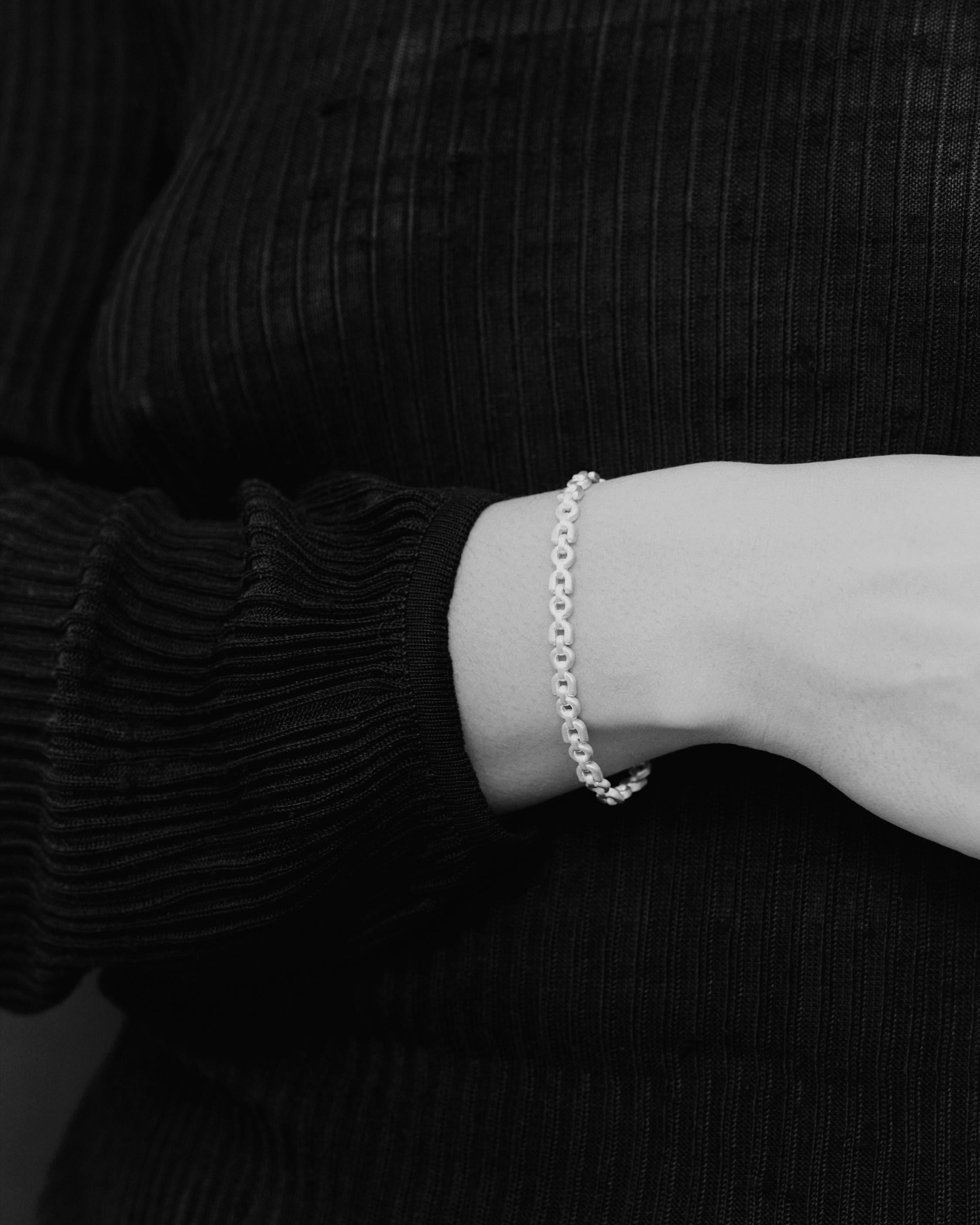 Referencing the durability and beauty of equine accoutrement, this is Tiana Marie Combes' signature equestrian-inspired chain bracelet made in Los Angeles from recycled 14 karat white gold. 

The Equestrian Chain Bracelet wears with an elegantly