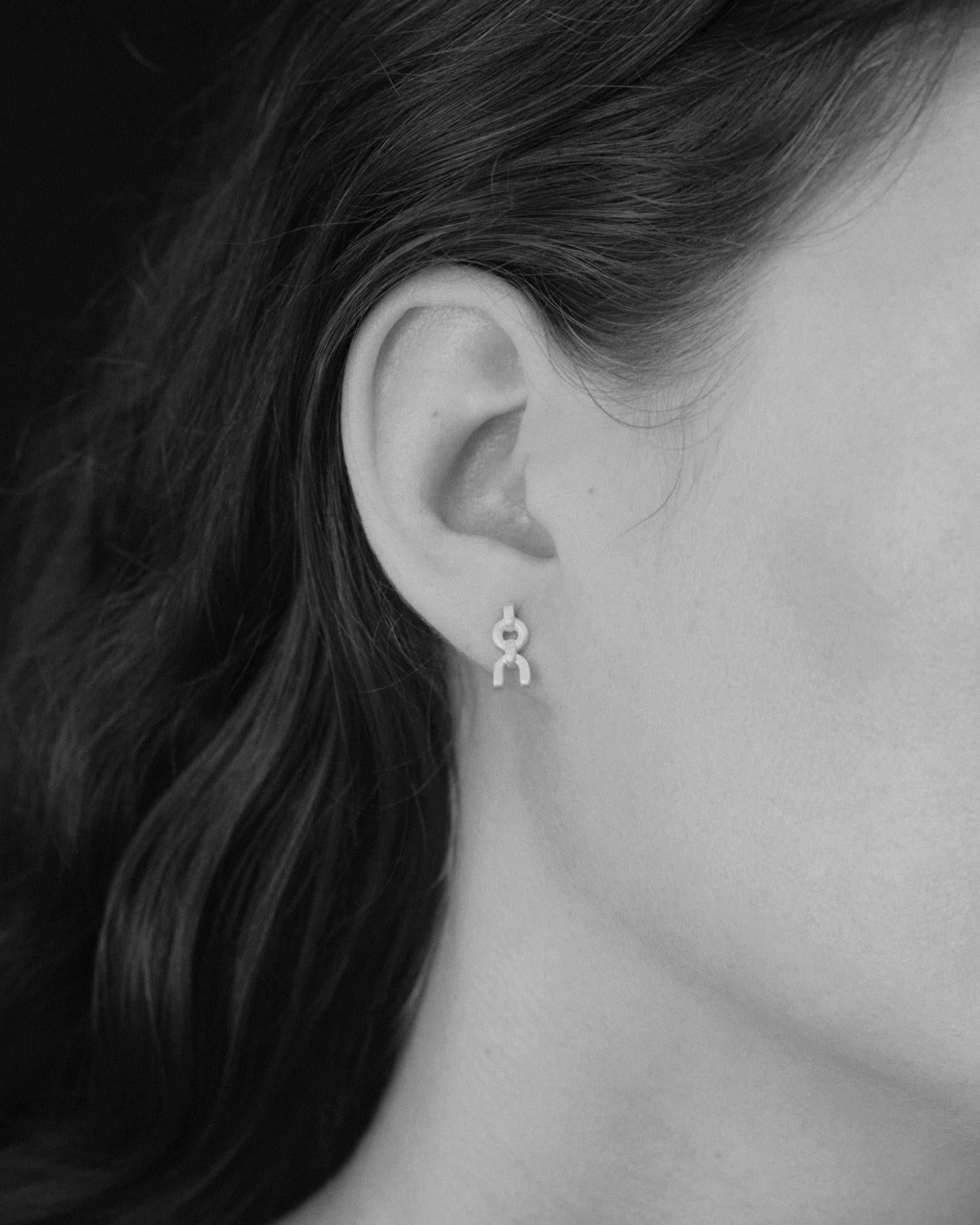 Referencing the durability and beauty of equine accoutrement, this is a symbolic element of Tiana Marie Combes' signature equestrian-inspired chain made in Los Angeles from recycled 14 karat white gold.

The Equestrian Chain Stud Earrings are a