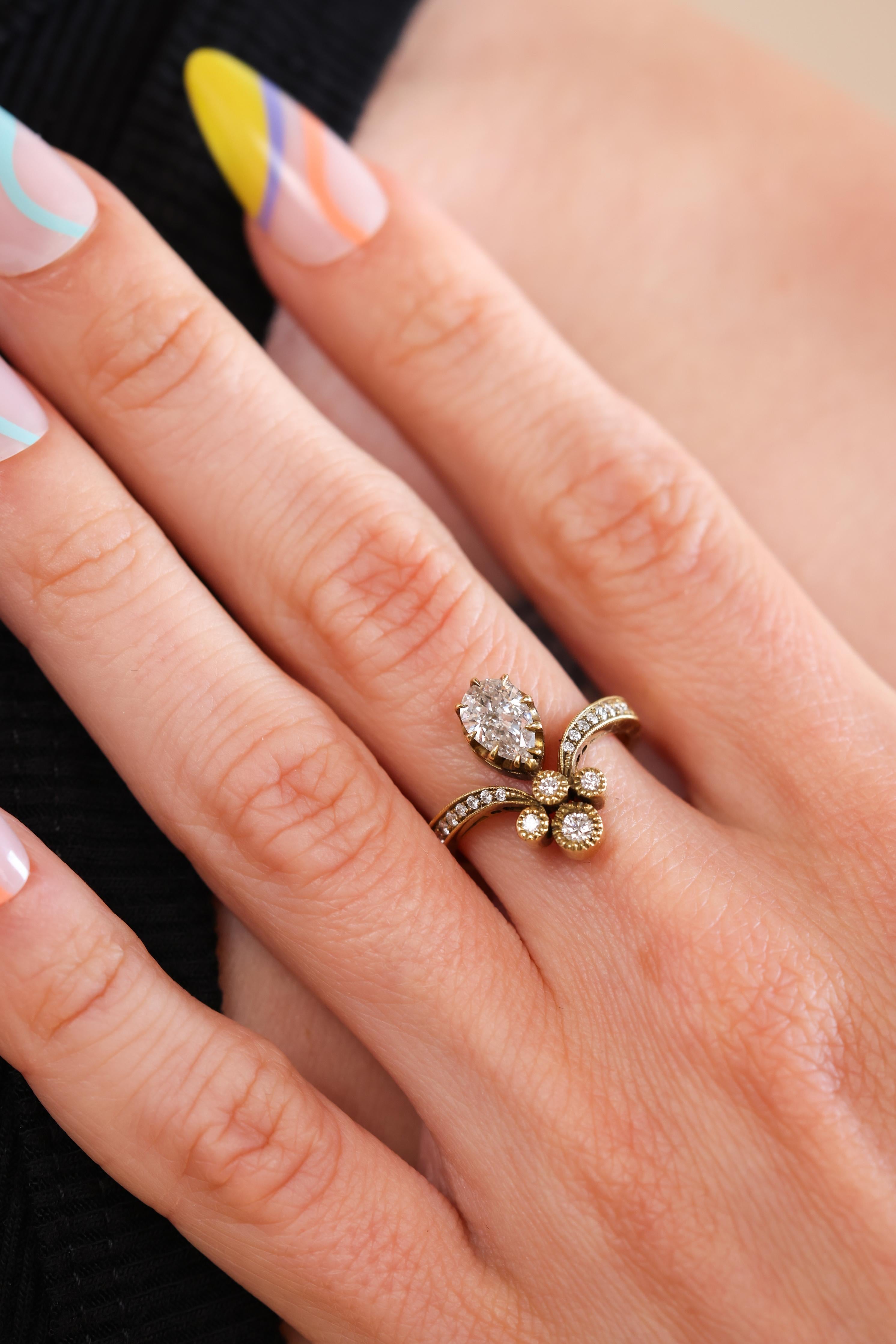 Trumpet & Horn's exclusive Tiara ring is reminiscent of Victorian times when jewelry and fashion were inspired by nature and romance. This unique diamond ring is made from 18k yellow gold and features a 0.69ct GIA certified Pear Shaped diamond. A