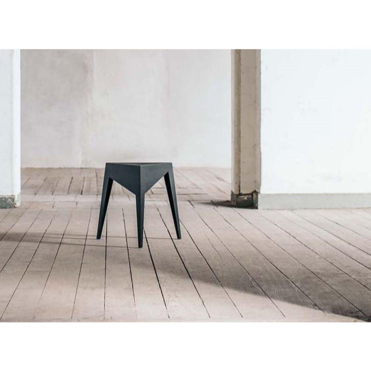 Tibalt stool by Matthias Scherzinger.
Dimensions: W 52 x L 45 x H 47 cm.
Materials: Solid wood oak.

Tibalt is a stackable stool concept with a convincing geometrical simplicity and aesthetic in which the filigree design is reduced to a minimal