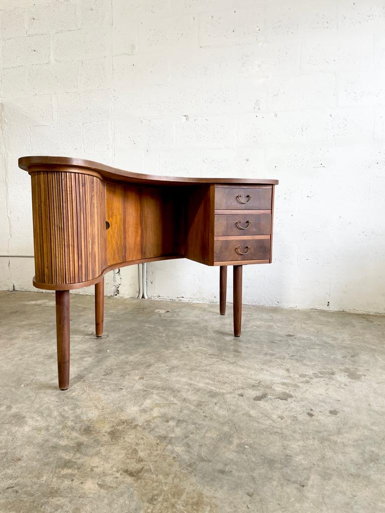 Rare Tibergaard Nielsen Kidney Shaped Floating Desk. Finished back. Tambour door on front and back. 54w 27d 30h