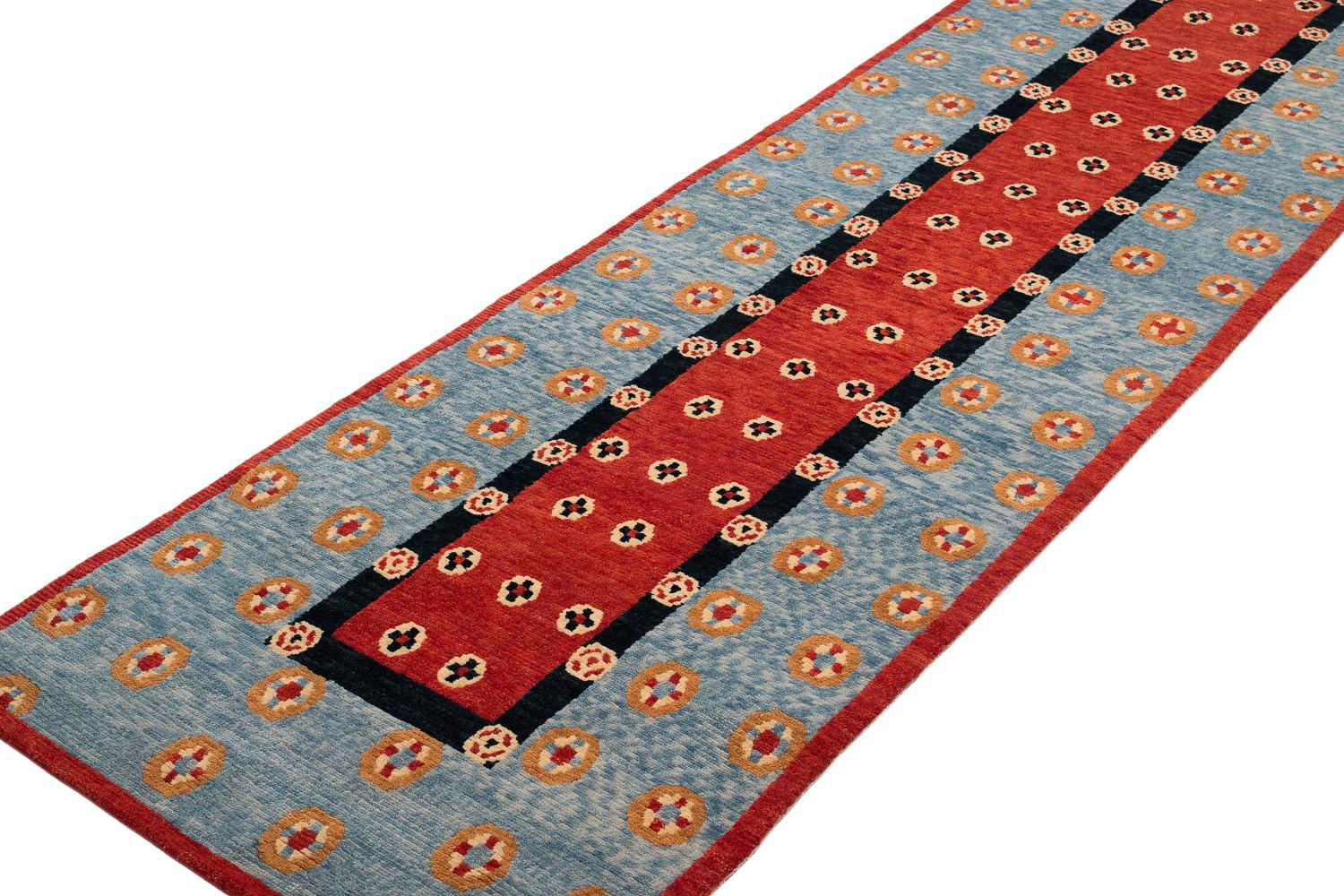 This runner is handwoven in silky hand spun Himalayan wool that is soft to the touch. The area rug features a traditional repeating geometric Tibetan motif in all natural dyes.