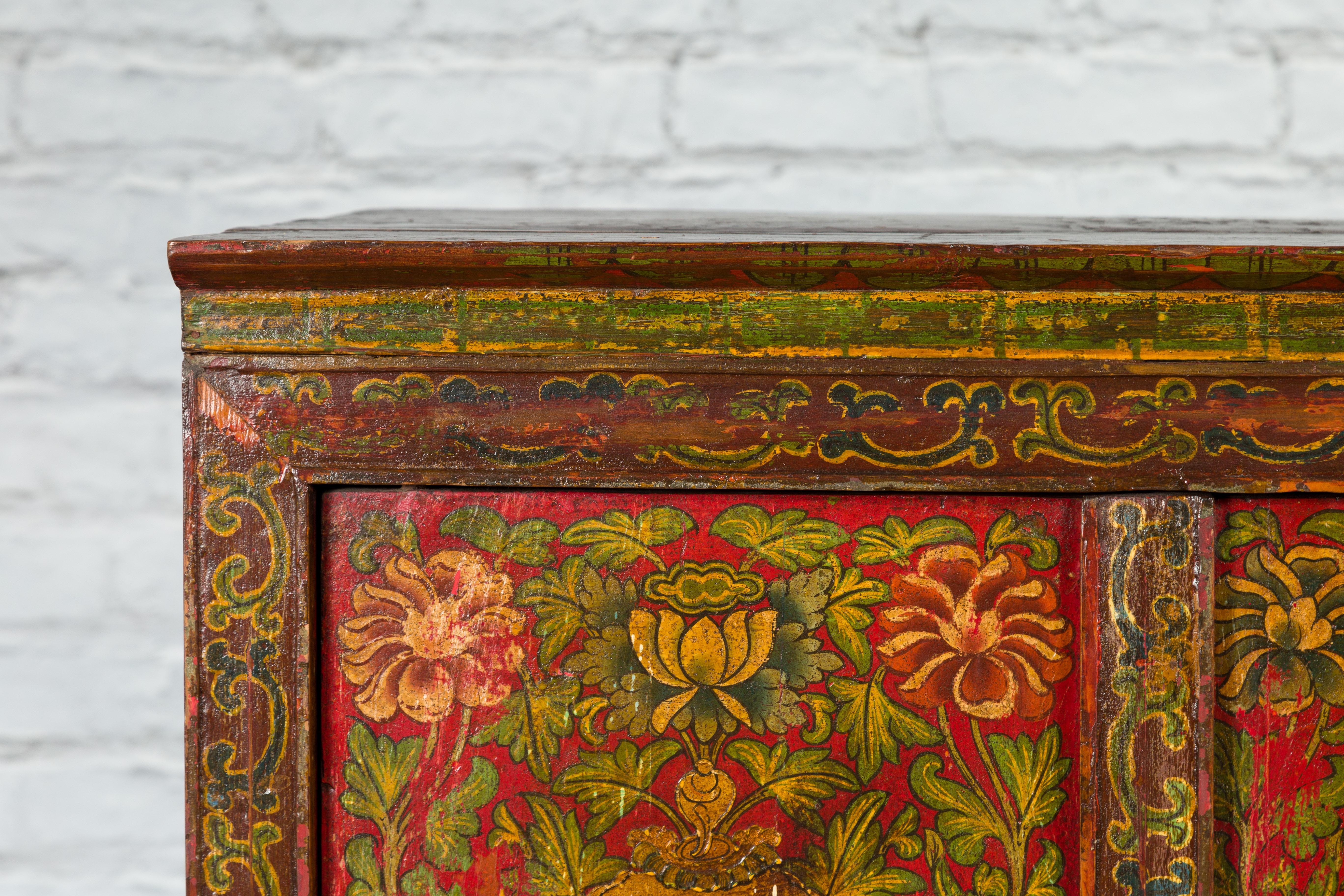 Tibetan 19th Century Cabinet with Hand-Painted Floral Décor on Red Ground In Good Condition For Sale In Yonkers, NY