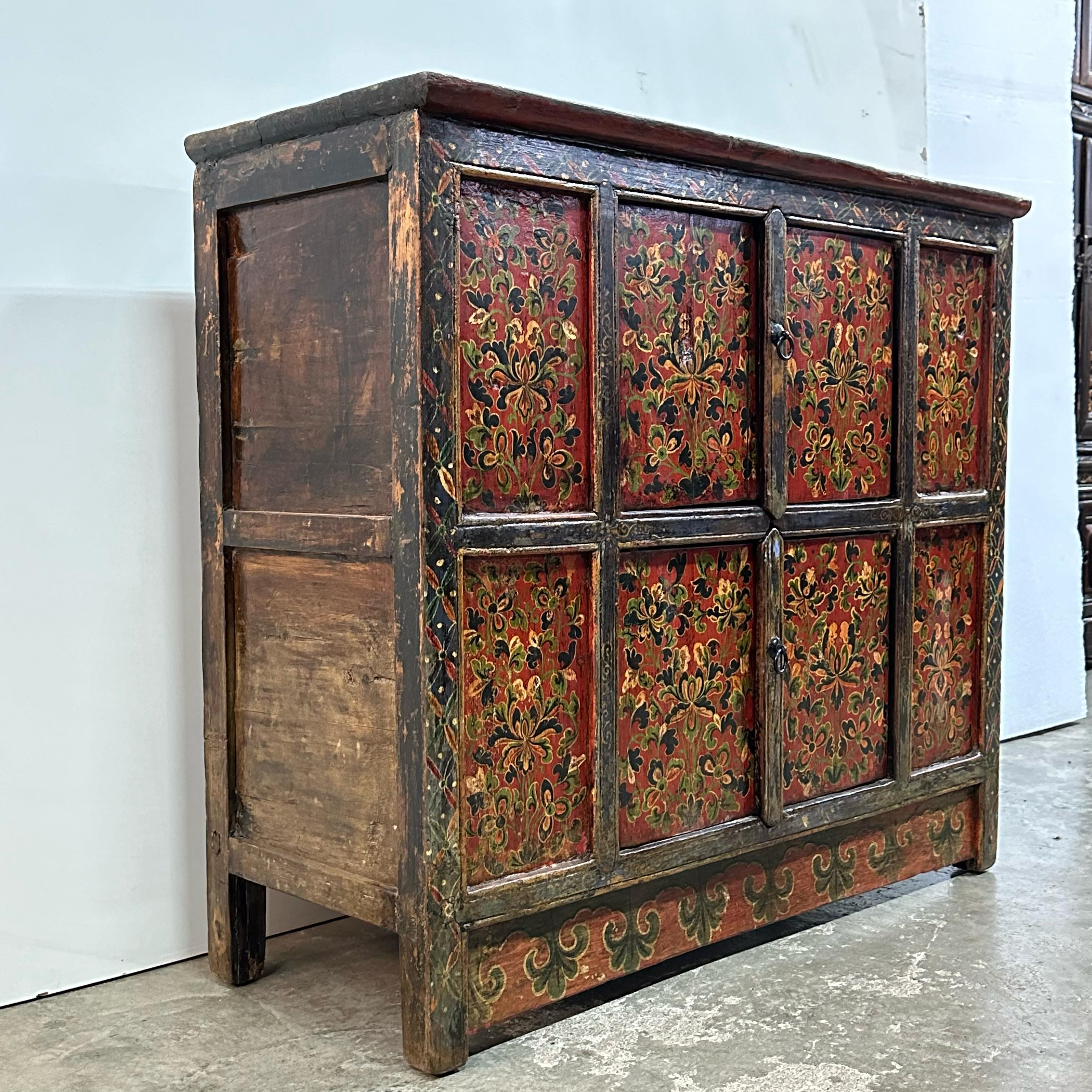 Qing Tibetan 19th Century Cabinet with Hand-painted Floral Design on Red Background For Sale