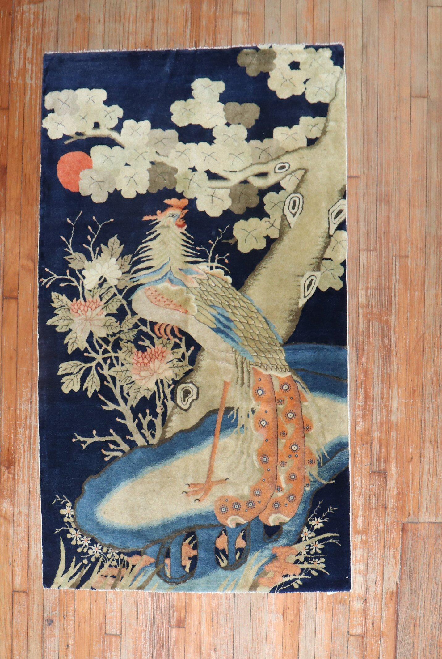 A fine quality antique Tibetan accent size rug depicting a large rooster on a navy blue ground. 

Measures: 3'9