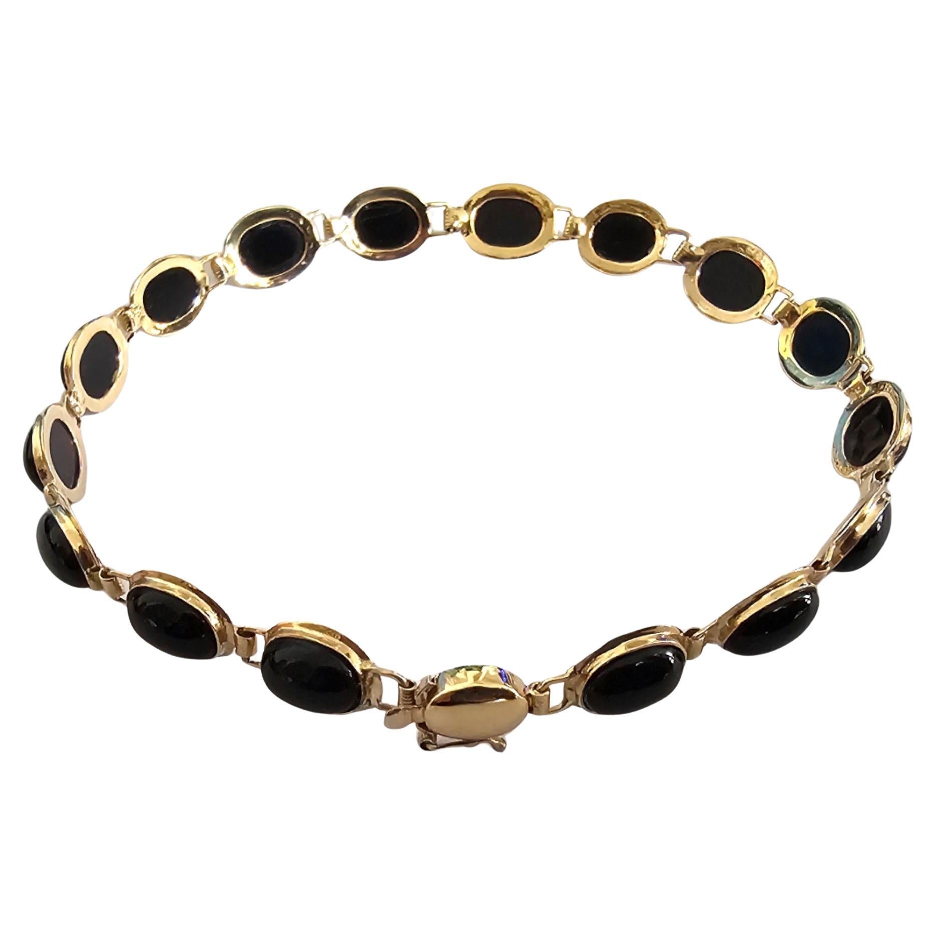 Tibetisches Perlenarmband aus schwarzem Onyx (mit 14 Karat massivem Gelbgold)