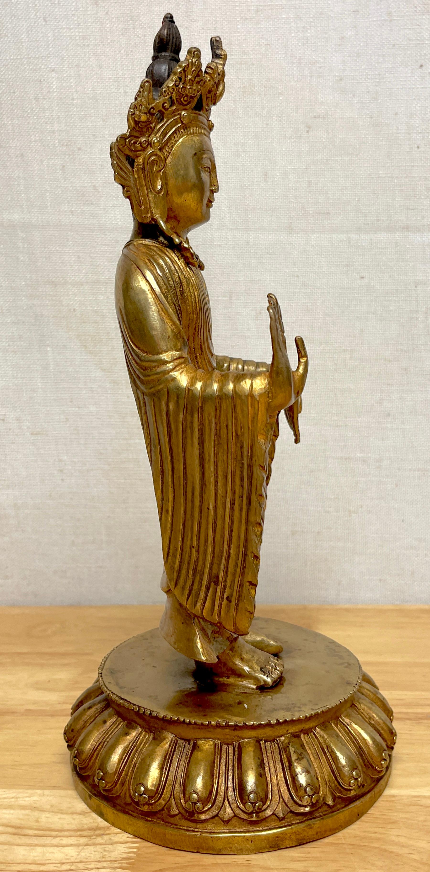 20th Century Tibetan Bronze Standing Gilt Bronze Buddha Offering Protection For Sale