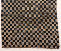 Alfombra tibetana Khaden con diseño de tablero de ajedrez, 142 cm x 76 cm