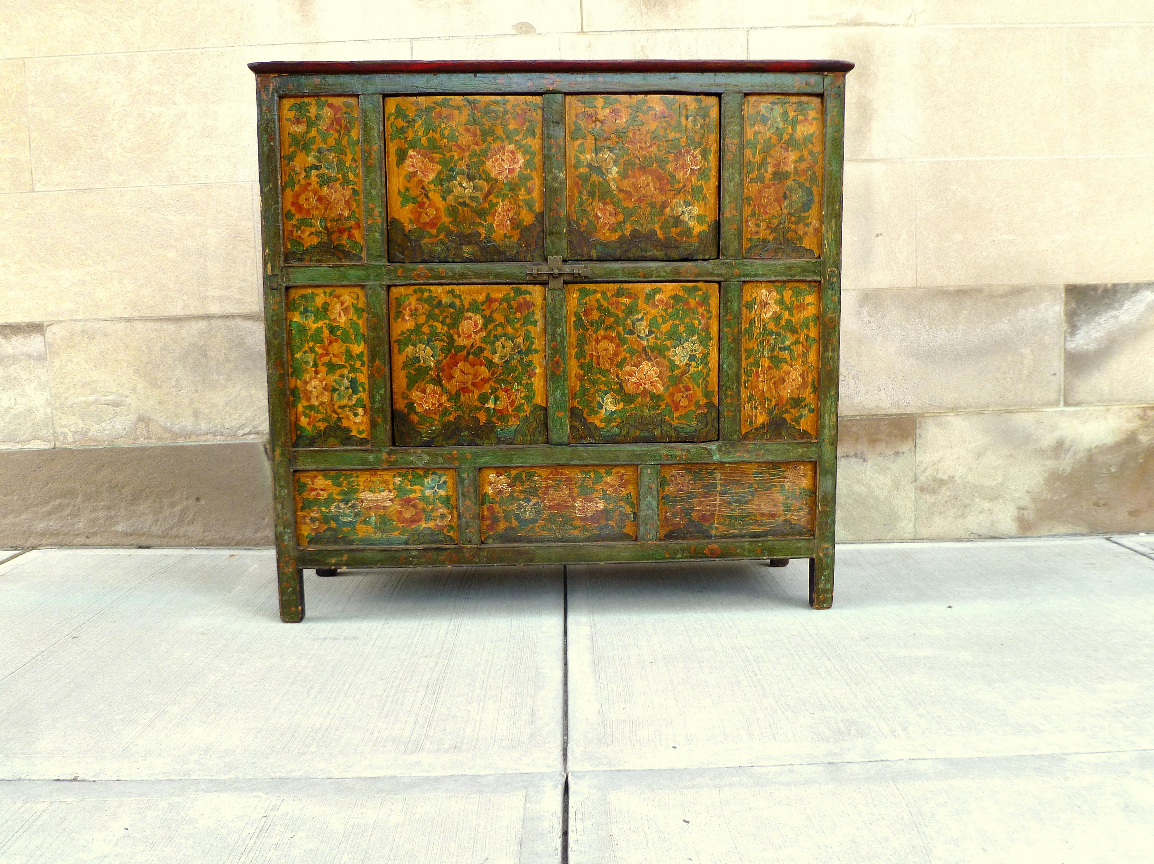 Tibetan chest with beautiful hand painted floral motif, two pairs of doors.