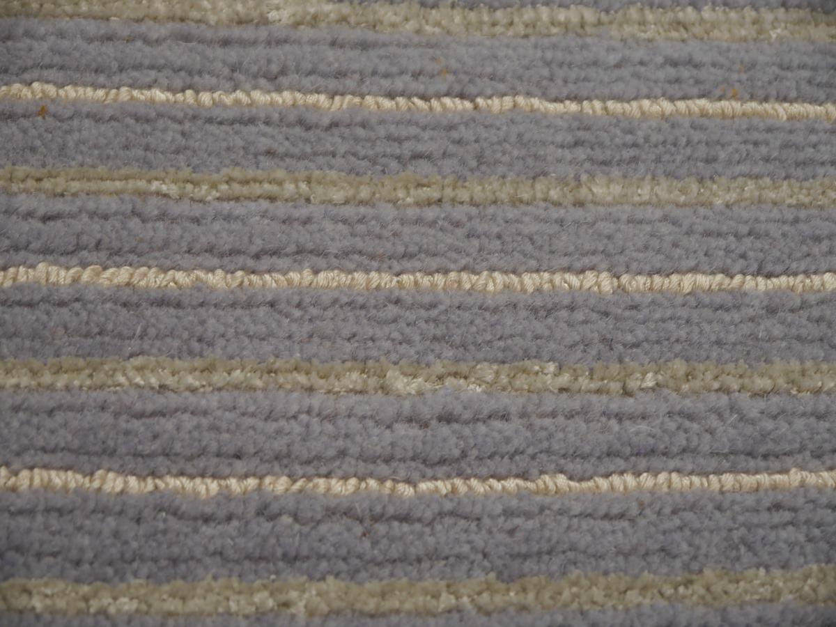 A beautiful contemporary modern design rug, hand knotted using finest wool bamboo silk in 3 x 2 ft / 90 x 60 cm. It has gray fringe on both ends, can also be ordered without fringe.

By Djoharian Design.

Striped rugs newer go out of style. In our