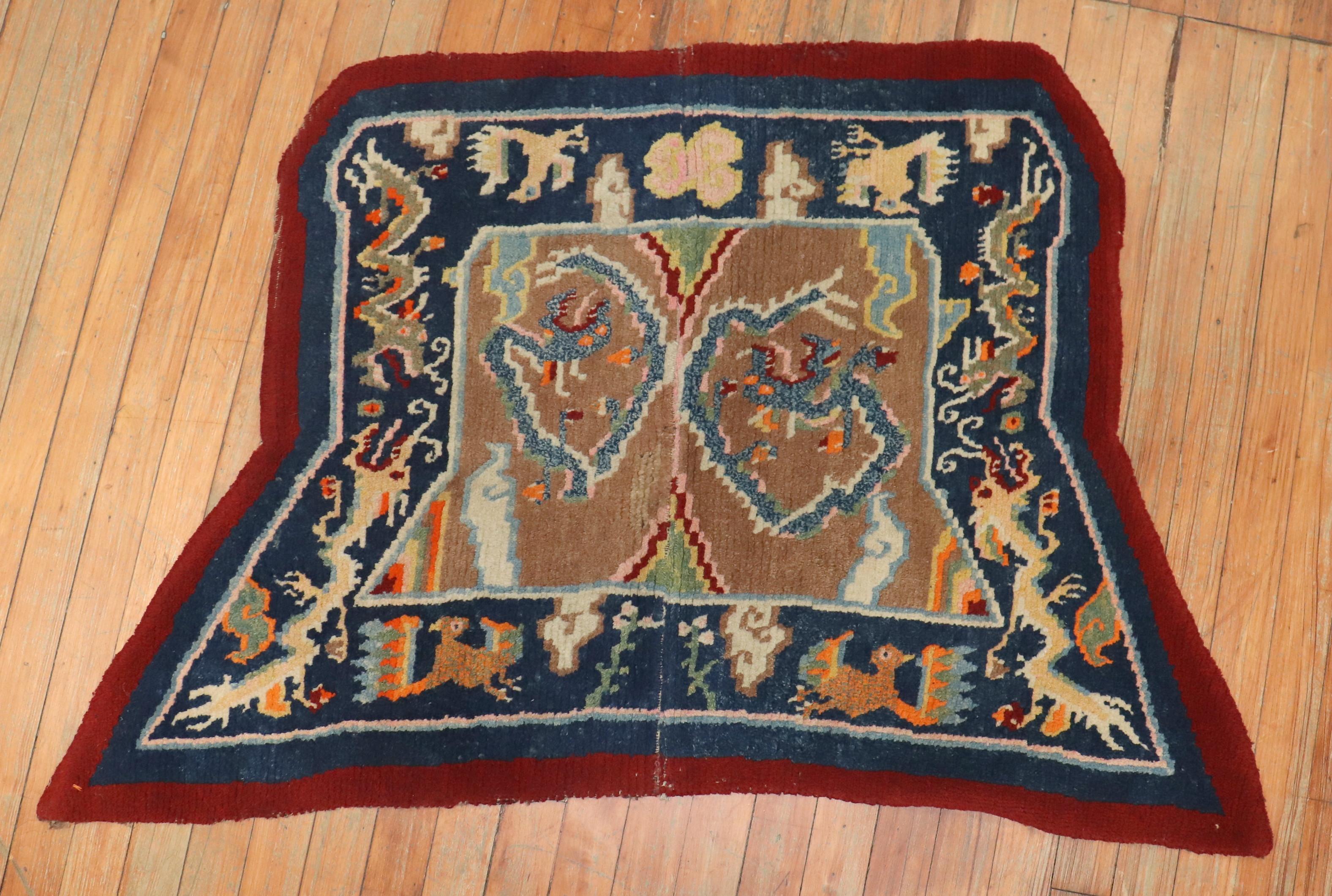An early 20th century Tibetan dragon horse cover textile rug,

circa 1900, measures: 2'5