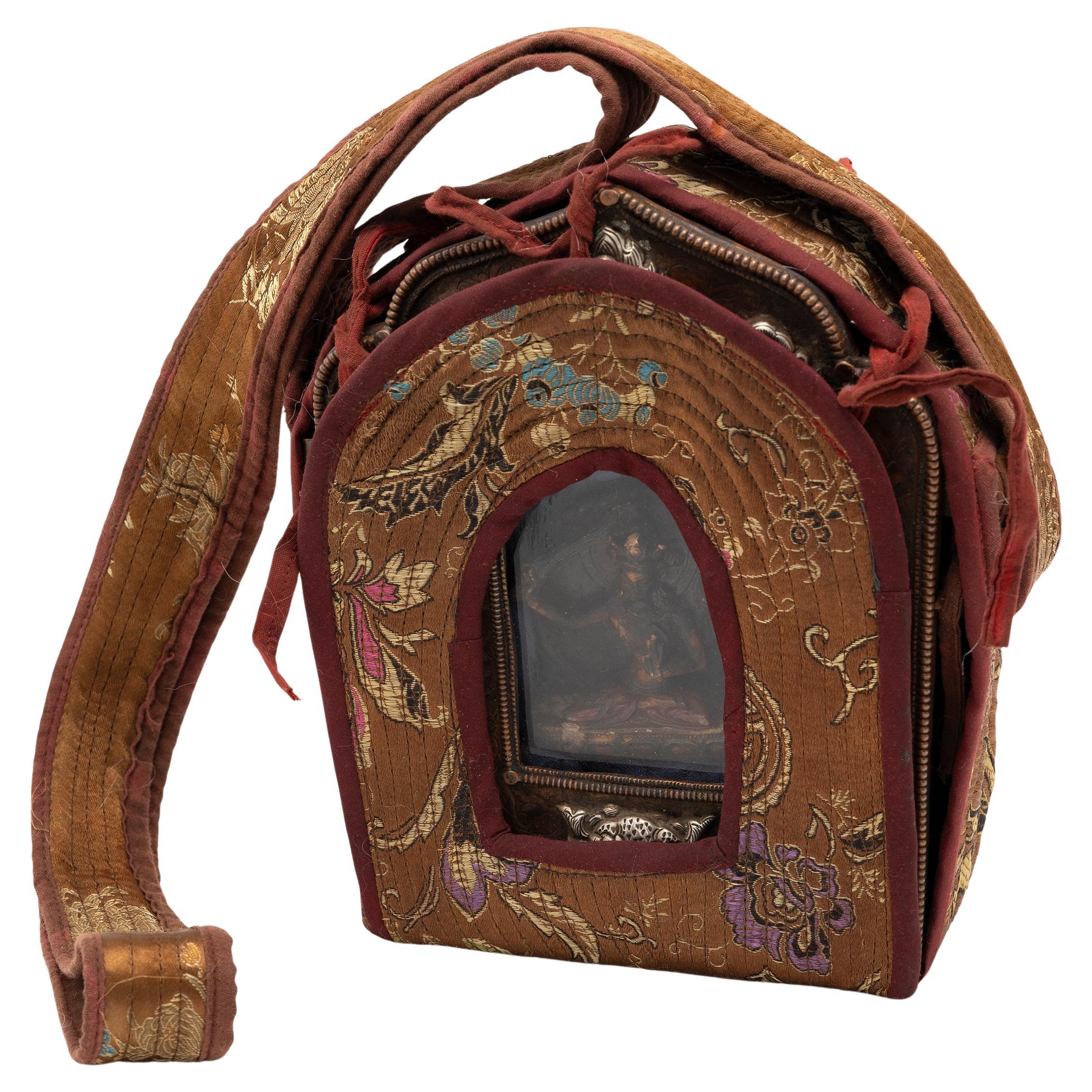 Tibetan traveling shrines, known as Gau, were believed to offer protective powers and were used to hold and carry sacred objects during long journeys. Crafted over a century ago, Buddhist followers may have purchased this intricate gau while on