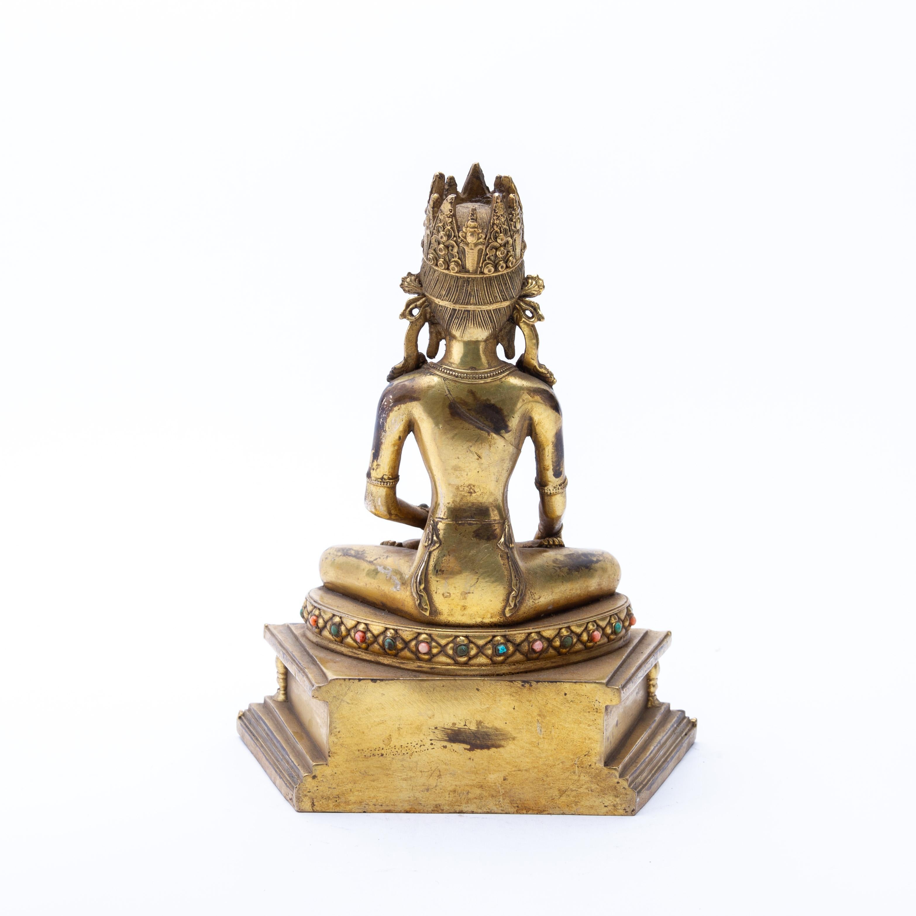 Tibetan Gilt Bronze Hindu Buddhist Sculpture of Buddha Inlaid Coral Late 19th C In Good Condition For Sale In Nottingham, GB