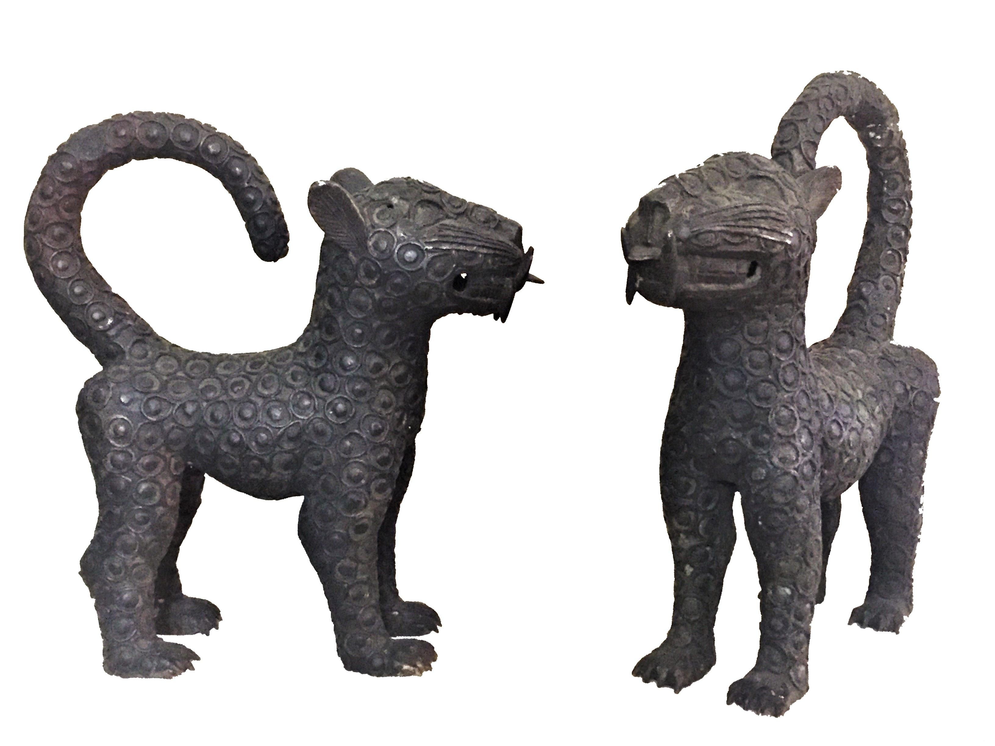 Tibetan Guardian leopards
A pair of matching patinated bronze sculptures
Early 20th century.

Dimensions: 
Height 15.25 
Width 4.75” 
Depth 13.75”.
 