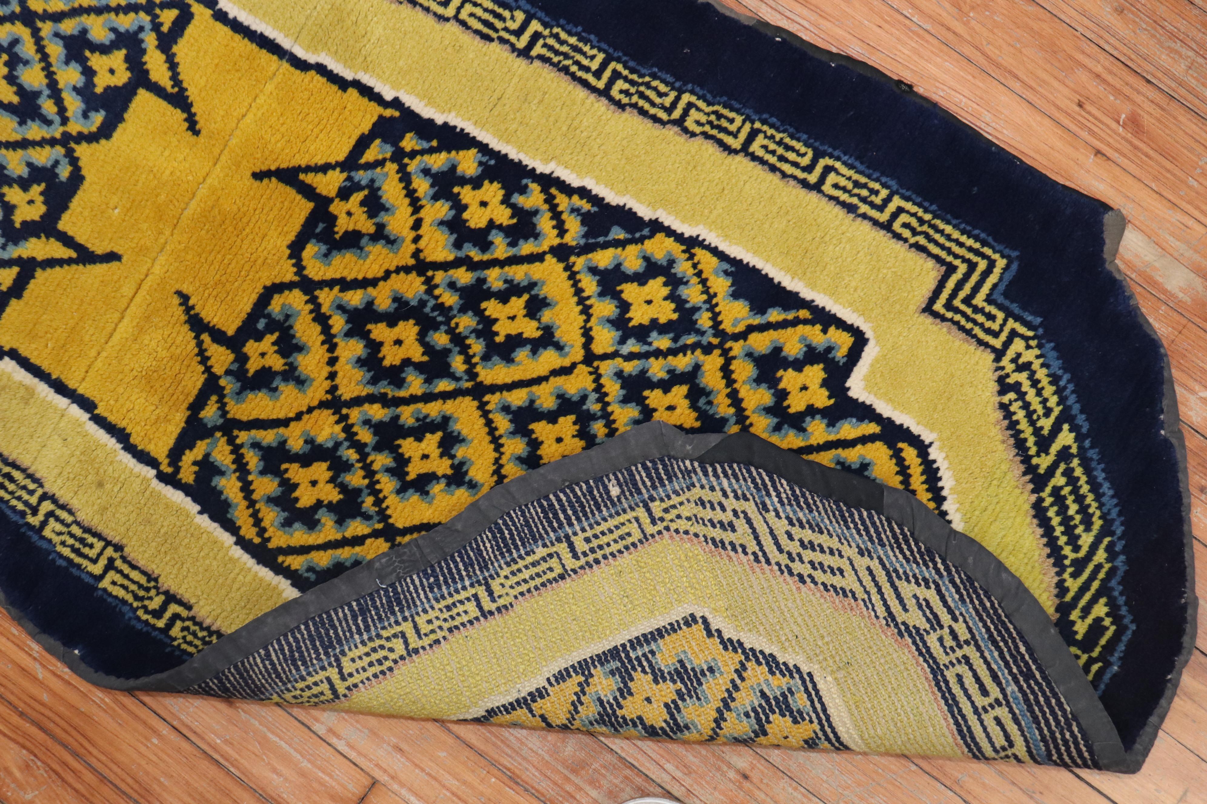 An early 20th century Tibetan horse cover textile rug in blue and yellow,

circa 1900, measures: 2'1