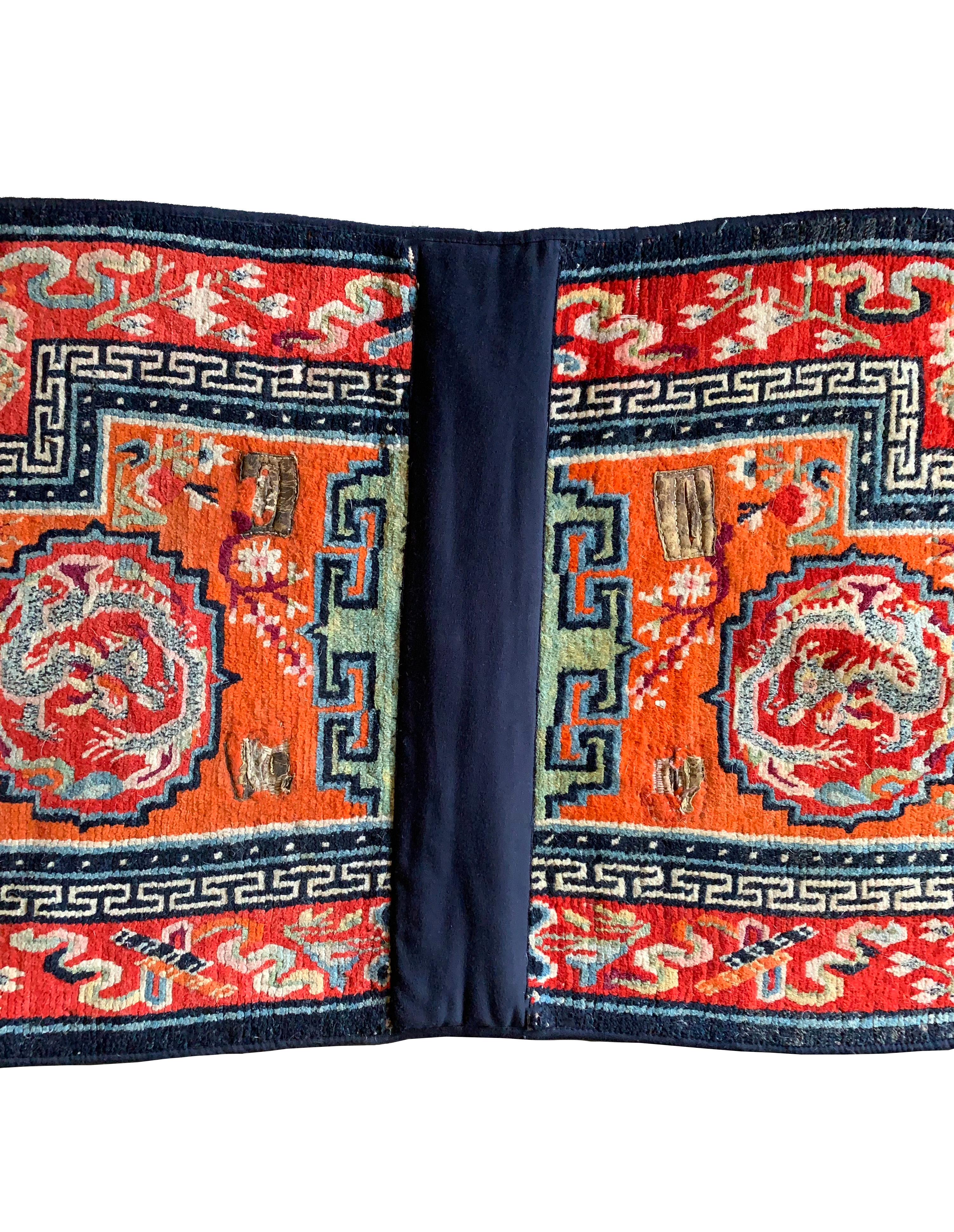 A saddlecloth, used as a decorative and padded element to accompany Tibetan horseman's saddles. Saddlecloths were placed on a horses back between the horses back and saddle of the ridder. This saddlecloth features a newly added cotton lining