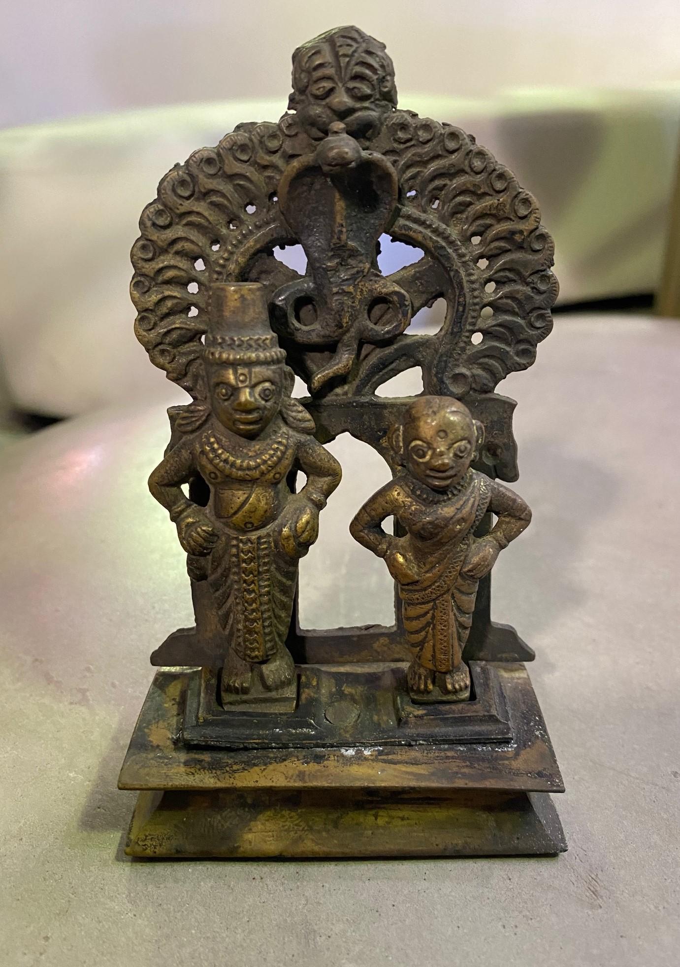 An interesting work. We are not sure of the significance of the standing couple and snake hanging over their heads. Likely Tibetan or Indian/ Nepalese. Has a beautiful patina acquired over time.
From a collection of South-East Asian, Tibetan,