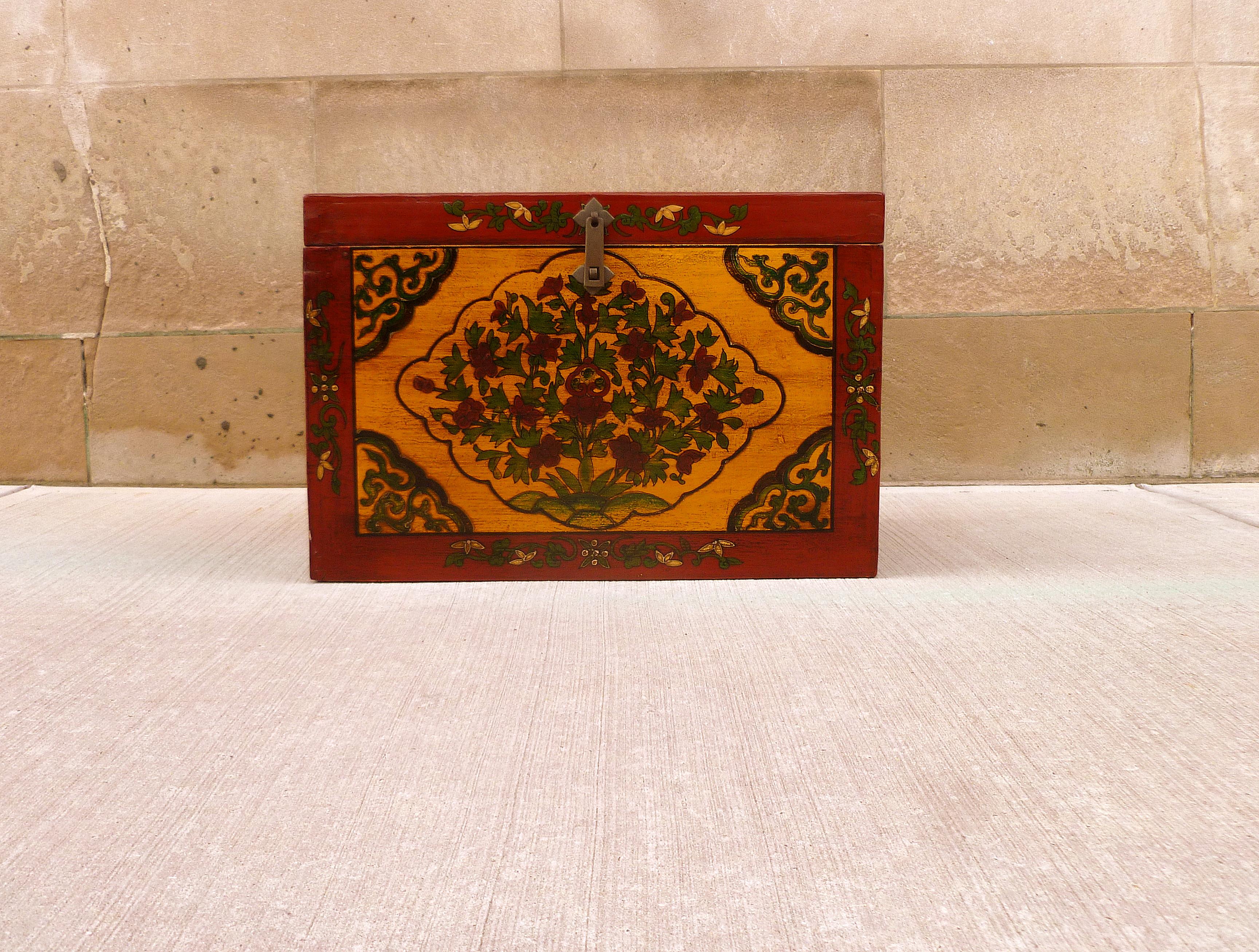 Tibetan large box with hand painted polychrome floral motif, beautiful colors and elegant form.