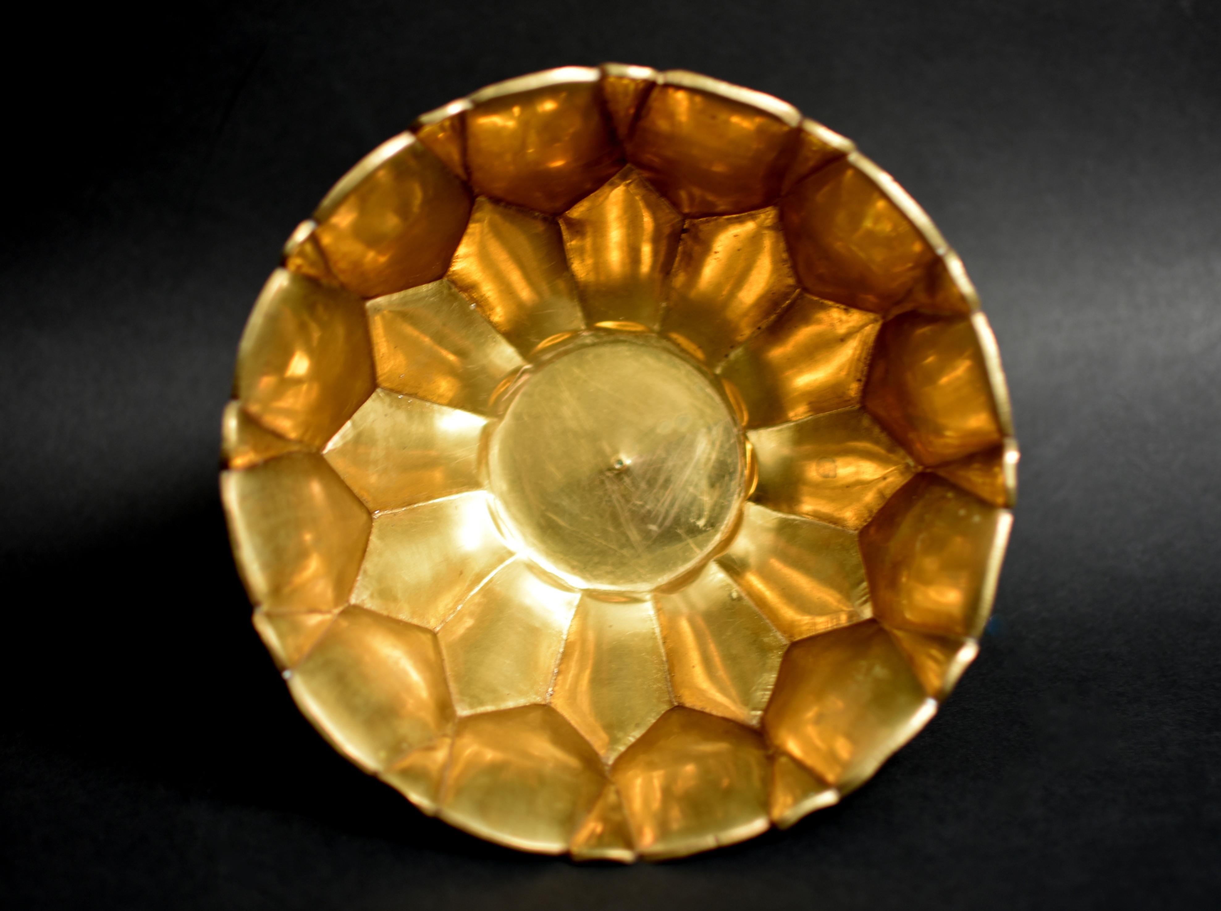 A rare, beautiful, solid brass, Tibetan offering bowl. Finely hand crafted, the 24-petal lotus with refined ridges sits on top an octagonal base. The bowl looks to be gilded although it has not been tested. Such a bowl is placed on the altar,