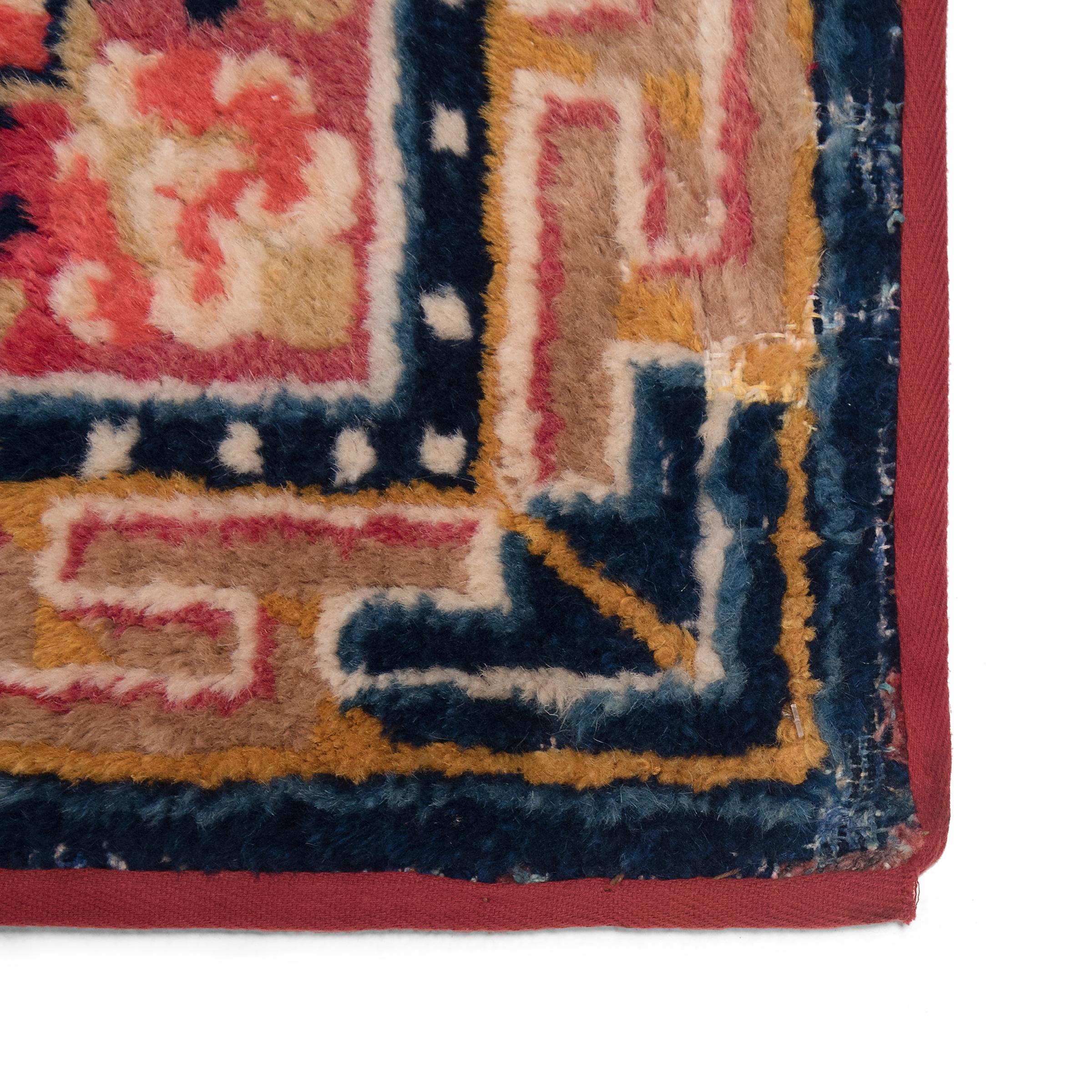 Tibetan Meditation Carpet with Dorje Medallion, c. 1920 In Fair Condition For Sale In Chicago, IL