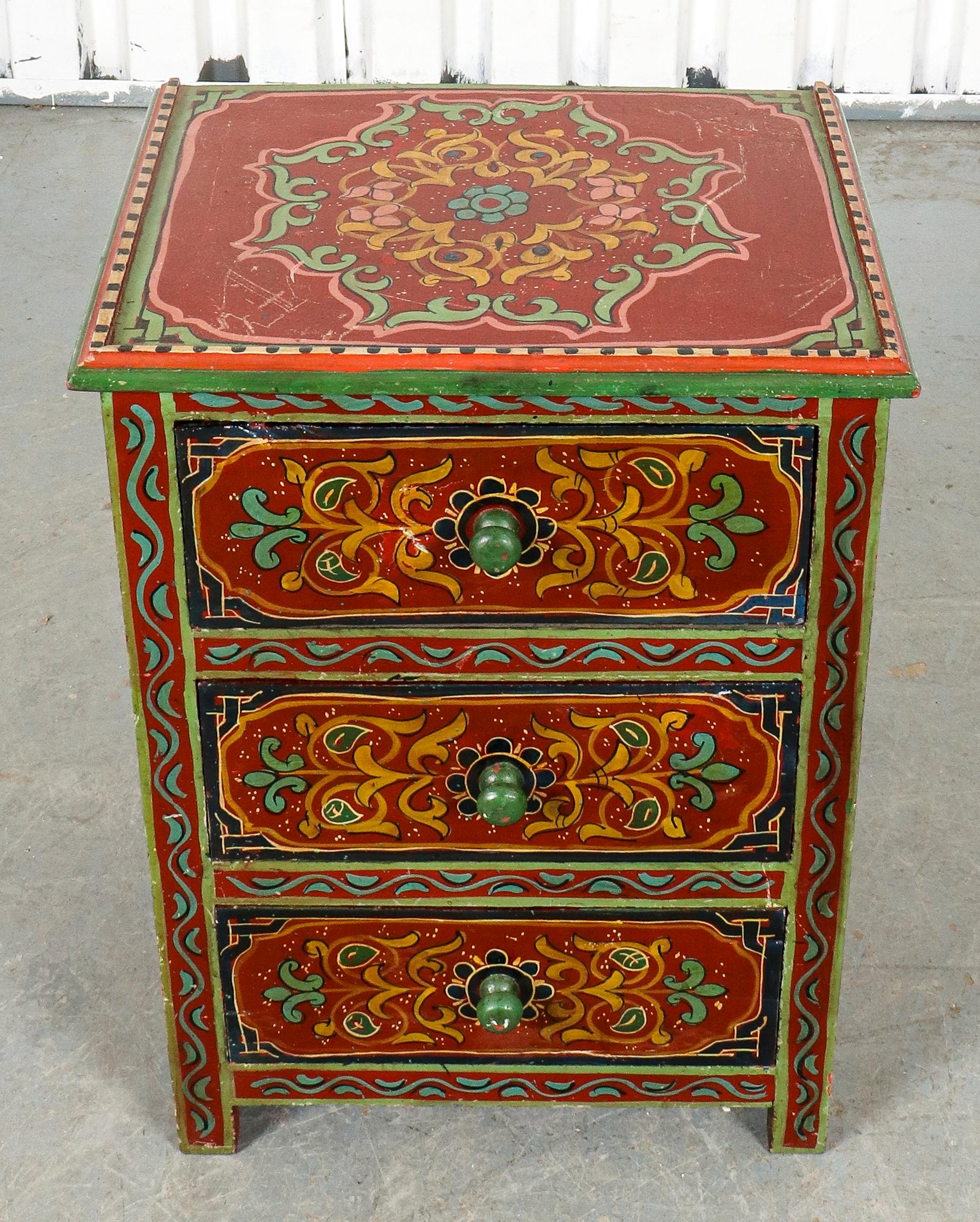 Tibetan paint decorated chest of drawers, three drawers, with multicolored ornamental decoration. 
Measures: 26.25