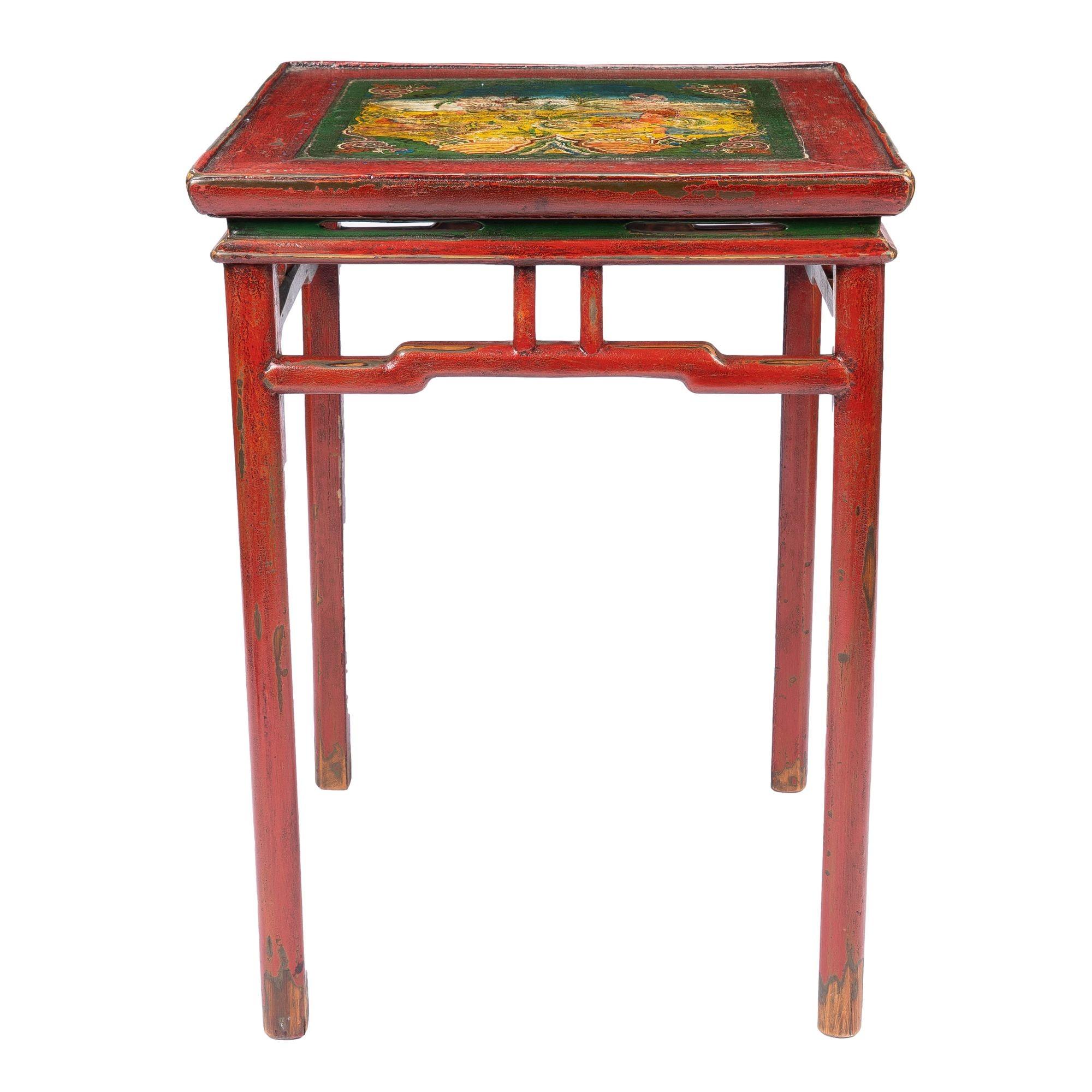 Tibetan red lacquered hard wood table with hump-back apron rails joining four turned legs. The painted table top features a fantastical landscape in polychrome enamels within a painted border.
Tibet, circa 1910.