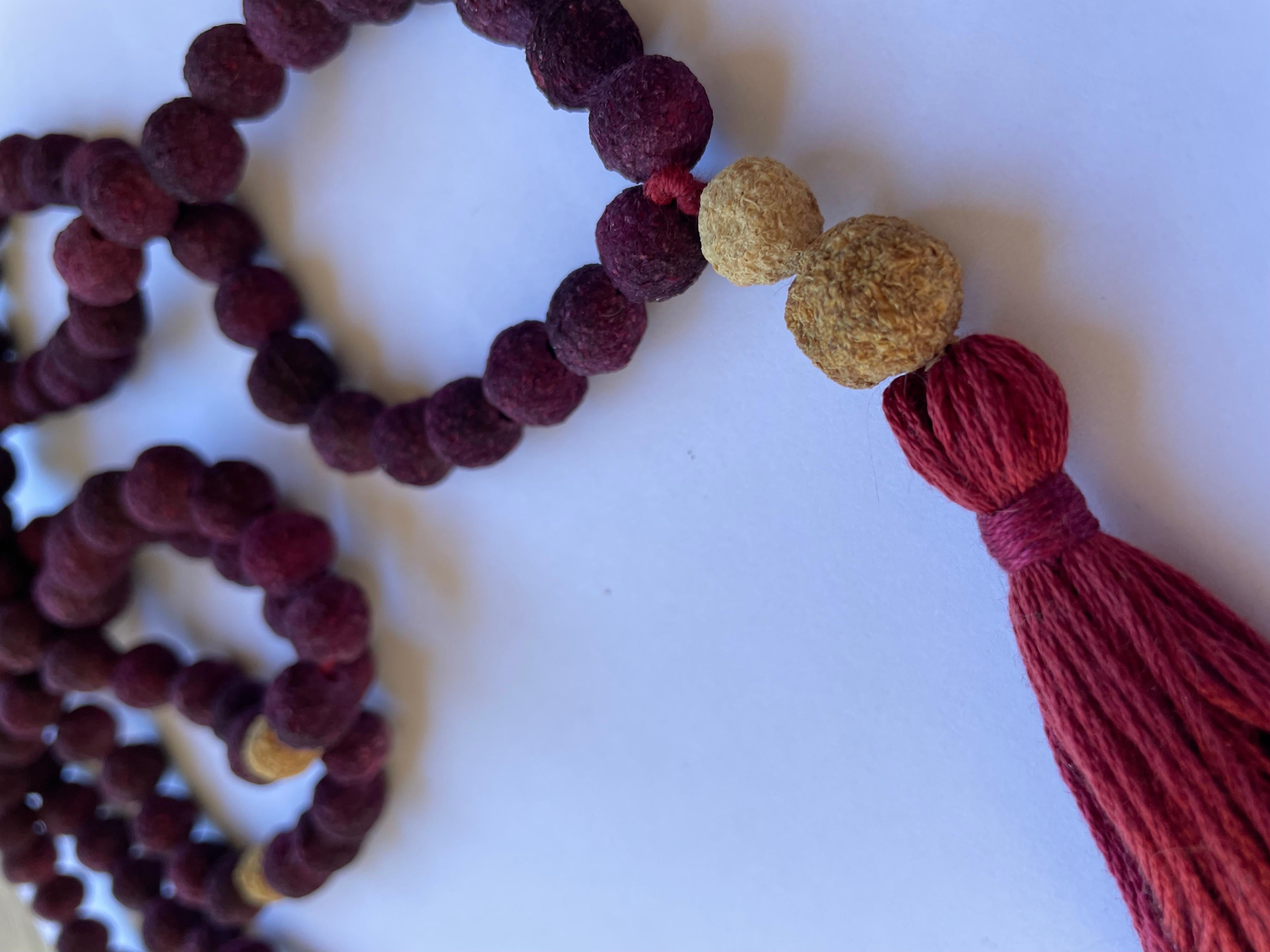 Red and white roses were used to creat this 108 Rose Petal Bead Mala. No knots. Organic cotton string and tassel.

Length 22”

Mala’s or Tibetan Buddhist prayer beads are similar to other prayer beads used in various world regions.  Some people have