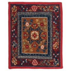 Tappeto tibetano con medaglione floreale, 1900 ca.